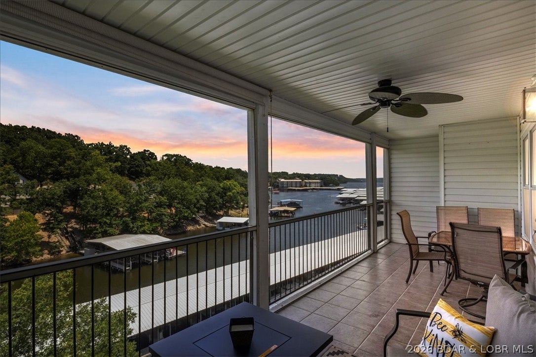 Discover the perfect blend of lake living and investment potential in the highly sought-after Lighthouse Landing Condominiums! This top-floor 2-bedroom, 2-bath condo offers added privacy with its end-building location and is ready for you to enjoy from day one. Unwind on the screened-in deck overlooking the peaceful cove, where you can even keep an eye on your included 12x32 boat slip. The package also includes a PWC slip with a drive-on hoist, making it easy to enjoy everything Lake of the Ozarks has to offer. Lighthouse Landing is known for its exceptional amenities, including a heated lakeside pool, tram to the docks, swim platform, and beautifully maintained grounds. Tucked away in a quiet cove yet conveniently close to shopping, dining, and entertainment by both land and water, this condo is ideal as a personal lake retreat, full-time residence, or income-producing investment. Nightly rentals are permitted, offering excellent flexibility and rental potential. Don't miss this opportunity to own in one of the lake's most popular condo communities!