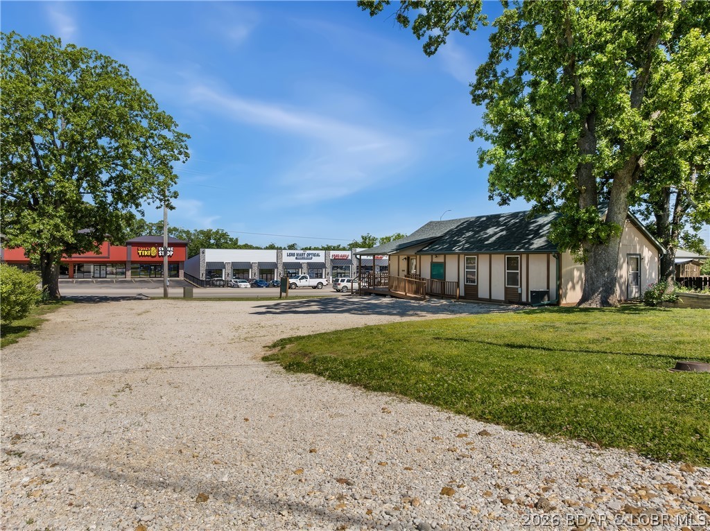 105 feet of US Hwy 54 frontage in Camdenton Mo., with up to 26,000 vehicles a day in peak season. Property includes 3 1/2 city lots, right in the mix with local shops, restaurants and banks. Currently used as a professional office, with several offices, but the possibilities are endless. Building has Hwy 54 access as well as access off of Chestnut St for customer access to your large parking lot and business. There is a second smaller parking area to the rear of the building off of Chestnut for employees and adds to the ease of access to come in or out of the business. Seller is retiring and ready for their next adventure. Call to schedule your private showing today.