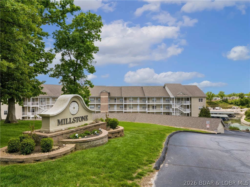 Beautiful updated Condo has an open Floor Plan with lots of Lake View Windows.  The spacious Living Room has a Fireplace, built-in Cabinets/Shelves and Sliders to the large Screened-In Deck with a Storage Room and take in the Main Channel View while enjoying the calm, protected waters of the Cove.  The Kitchen has Custom Cabinets, Granite Countertops, Stainless Steel Appliances, Stove w/double Oven, Pantry, wrap around Breakfast Bar and Tile Floors.  The nice Laundry Room is just off the Kitchen and has plenty of Storage Cabinets.   All 3 Bedrooms have full Bathrooms and Walk-In Closets.  The Master Bedroom/Bath has a Walk-In Shower, Jetted Tub, double Sinks and walk out Sliders to the large Screened-In Deck.  Millstone offers a Community Pool and Fitness Center.  Great location close to Tap & Grill, Shady Gators and Horny Toad Restaurants.  This peaceful Cove setting offers fantastic Lake Views and close to Shopping, Medical and Service Stations in Laurie.  Enjoy the West side of the Lake and Lake Front Living.