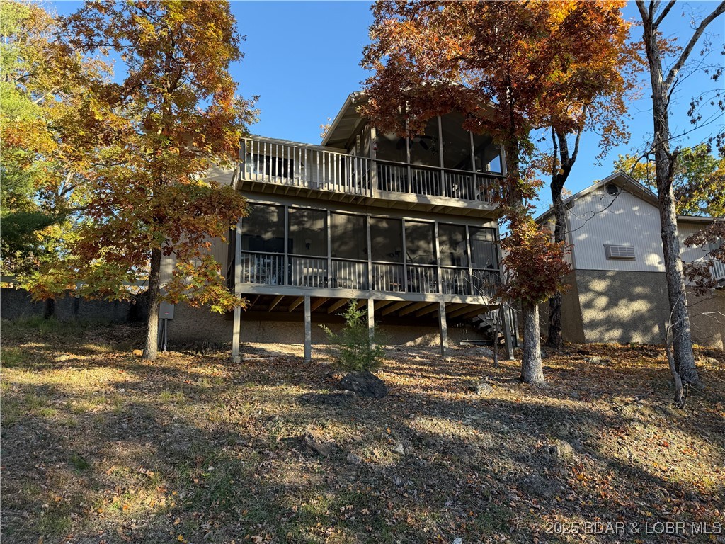Welcome to this pristine, turnkey move-in-ready home, located in the vibrant heart of Tan Tar A. With 2 long-term tenants in place you will be generating income from day one!! Imagine unwinding on a screened-in porch where every evening feels like a private retreat. Gently swaying in a cozy chair, the soft glow of the sunset as it paints the sky in gold and rose hues and relish in the lake view. The view stretches across the lush green fairway, with the whisper of the evening breeze. The screens invite in the fresh air while keeping the space perfectly serene—no bugs, no worries—just the tranquil symphony of nature. Whether you’re sipping your favorite drink, or soaking in the lake or golf course view, you have a front-row seat to the beauty of both the game & the day’s end— every sunset feels like it’s just for you. Home offers unparalleled convenience, minutes from restaurants, shopping & all that the lake has to offer! Plus full permits, plans, survey, & preliminary approvals for a new garage build. Whether you’re seeking a smart investment or a serene retreat, this property delivers both. Don't miss this exceptional opportunity to experience the very best of Tan Tar A living!