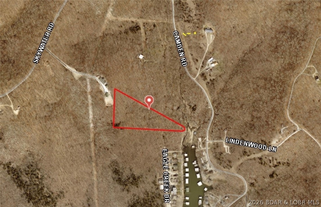 Build your dream home at Lake of the Ozarks! Located in Gravois Mills near the 45 mm, this vacant lot offers approximately 50 feet of lake frontage and a wonderful setting for your future lake retreat or full-time residence. Enjoy waterfront living, beautiful surroundings, and convenient access to all the lake has to offer. Bring your plans and make your vision a reality!
