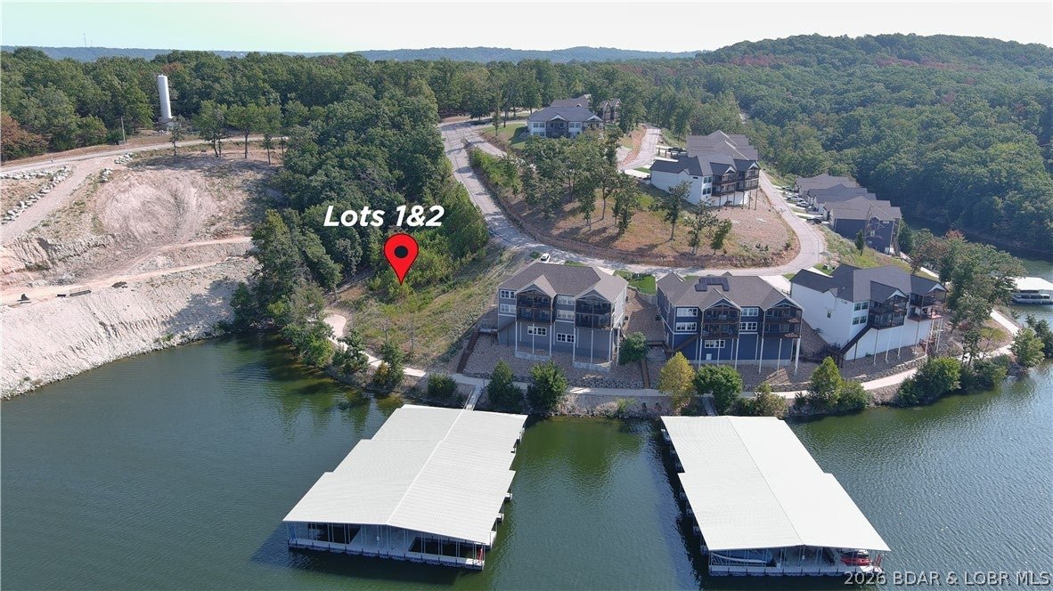 Amazing opportunity to purchase a double lakefront lot in a well established subdivision. This lot will allow you to build a private home or a villa in The Villas of Tuscany Subdivision. This location is one of the most ideal lots within the subdivision. Amenities are already in place with water & sewer, internet access through Spectrum. You will enjoy the amazing pickle ball court, community pool & bath house, and golf cart path down to the community docks. Note- proposed structure shall be approved by Architecture Review Committee and landscaping will also need to be approved. (Subdivision will maintain landscaping of home, just as a Villa). This lot DOES have private dock rights, no other remaining/listed lakefront lots will have that!!!