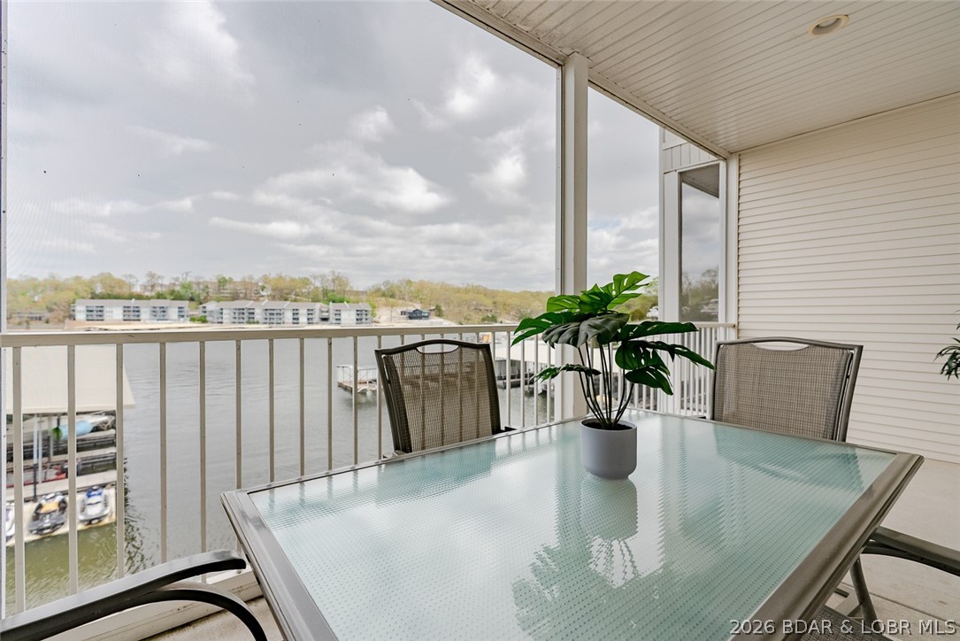 Wake up to the lake every single morning! This stunning lakefront condo at the Robins Complex puts you right in the middle of everything Lake of the Ozarks has to offer, and it shows. From the moment you walk in, you'll feel it. This place is sharp, clean, and ready to impress. Step out onto your concrete deck and soak it all in. The water is right there. And so is your very own boat slip — because life at the lake is better when you can hit the water whenever you want. Nestled in the heart of Osage Beach at the 1 mile marker of the Grand Glaize, just minutes from the best entertainment, dining, and shopping the lake has to offer. The strip, the top lakefront restaurants, it's practically at your doorstep. Not to mention everything that the Robins Complex has to offer, with reasonable HOA dues, and a community that welcomes you unlike any other. Whether you're dreaming of a weekend escape that feels like a vacation every time, or looking for a smart rental investment that practically sells itself to guest, this one checks every box. Strong rental appeal, a location people chase, and a unit that flat-out shows well. Opportunities like this don't sit long. Come see it for yourself.
