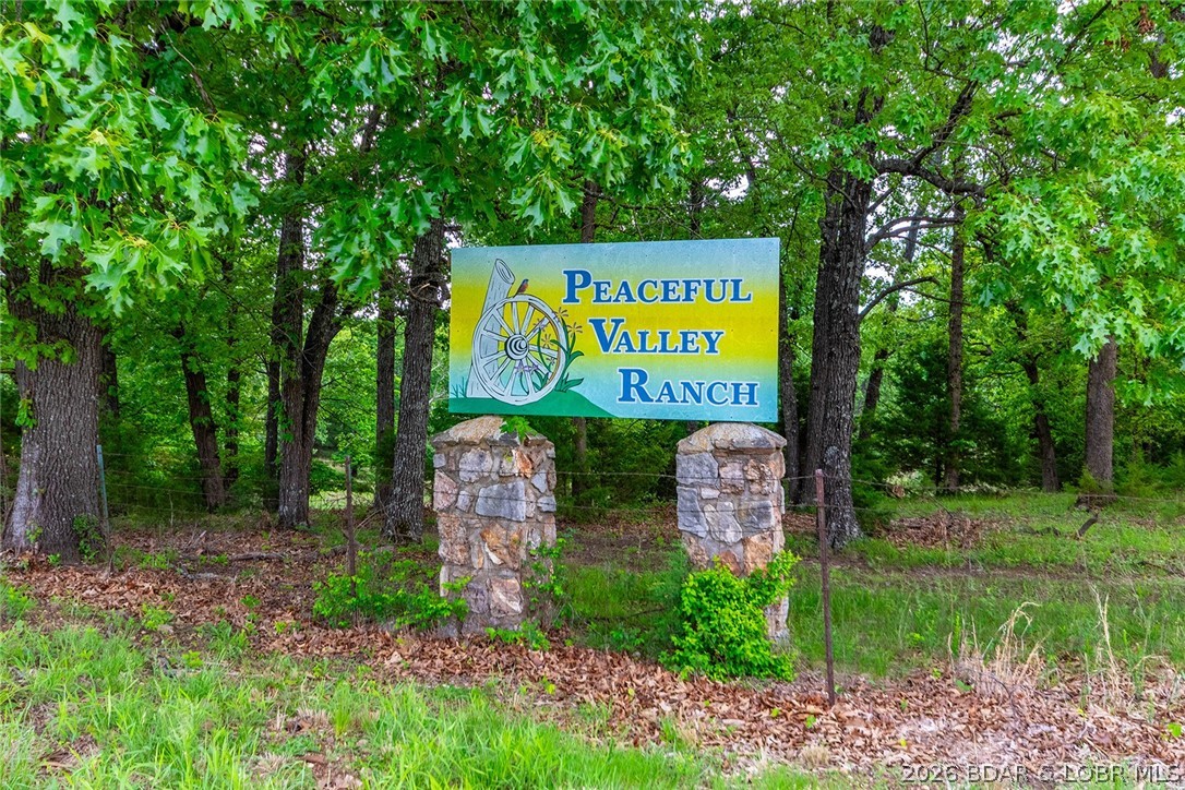Peaceful Valley Ranch offers 48± acres in Morgan County near the Lake of the Ozarks, combining scenic valley views, recreation, and convenience in one private setting. The property features three stocked ponds, including one with a concrete patio and fire pit area designed for relaxing evenings and outdoor gatherings. A well established trail system with over one mile of trails provides easy access throughout the property for hiking, ATV riding, and exploring the landscape.
The land offers a mix of open areas and timber, creating excellent wildlife habitat for deer, turkey, and other native wildlife. An existing home sits on the property and could be restored for continued use or removed to create a custom homesite overlooking the surrounding valley. A pull through RV pad with both 30- and 50-amp service allows for immediate enjoyment and flexibility.
Located approximately one half mile from Millstone Marina and Tap and Grill Lakeside Brew Haus, Peaceful Valley Ranch provides quick access to boating, dining, and lake activities while still maintaining a quiet and secluded atmosphere.