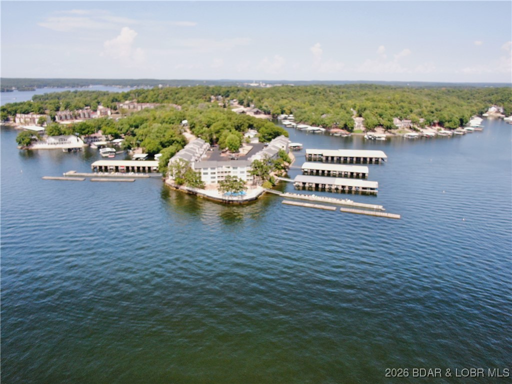 This amazing condo in highly sought after Bay Point Condos located on the 10mm can. Fully furnished and ready for lake time fun or an incredible vacation rental investment. Enjoy a drink on the lakeside deck while soaking up the spectacular sunsets. Bay Point has an incredible lakefront pool right at the waters edge, nice club house area, Parkette w/grills & picnic tables, fitness room and the most spectacular views of the main channel. Bay Point is an owner managed complex which helps keep assessments low.