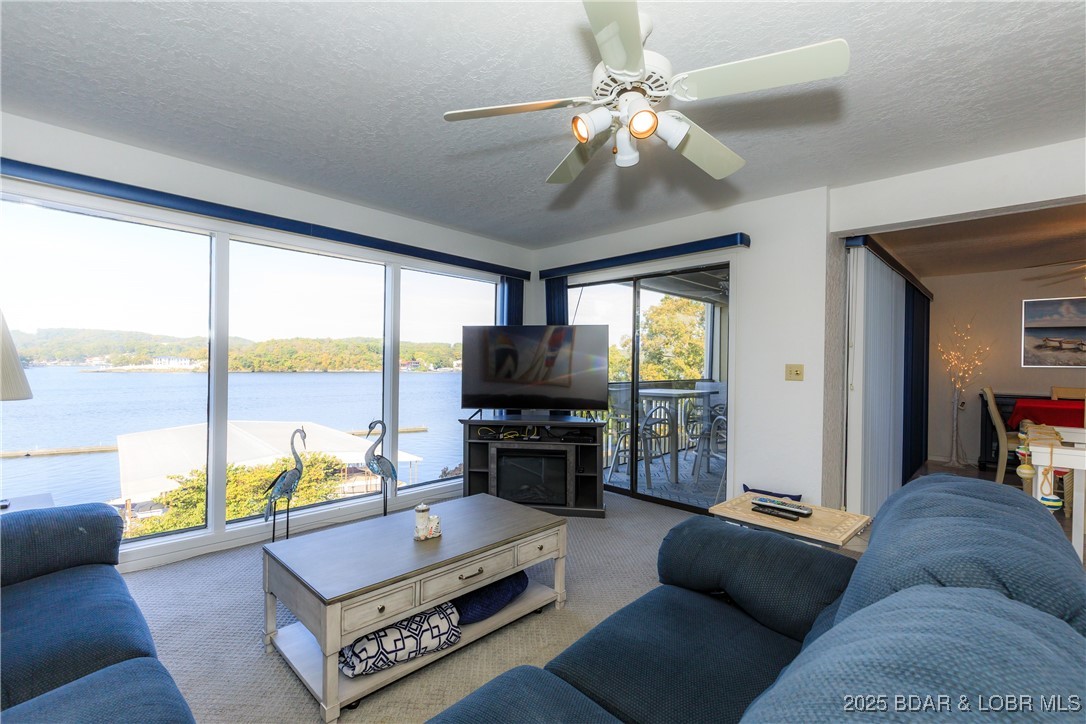 Welcome to your lakeside retreat — where life slows down and every moment feels special. This charming two-level condo offers 3 bedrooms and 3 full bathrooms, perfectly designed for comfort and connection. Sip your morning coffee or unwind with evening cocktails on one of two inviting decks, surrounded by panoramic lake views and unforgettable sunsets. Whether you’re seeking quiet reflection or joyful gatherings with family and friends, this is where memories are made and spirits are renewed. 
Complex amenities: 2 pools, Fitness Room, Clubhouse, Kids Play Area, Dog Park, Firepit Area, Boat Docks, Boat Trailer Parking. **Excellent HOA - INSURED - FUNDED RESERVRES - NO SPECIAL ASSESSMENTS
**Offered for additional purchase is another 10x24 boat slip w/ lift, remote and dock locker (Dock 2, Slip 2L). Inquire for pricing.