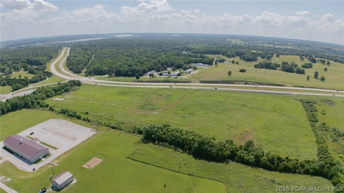 Prime 14-acre tract with 1700' of Highway 65 frontage! This property offers outstanding exposure and convenient accessibility directly off 65 Highway. Situated just 8 miles from Warsaw, MO which offers Truman Lake and Lake of the Ozarks access! Whether you're looking to build your dream home, start a business, or invest in land with strong traffic flow, this property provides endless potential. For a better look at the lay of the land, watch the full video tour on YouTube. https://youtu.be/zvc1pO2THnk