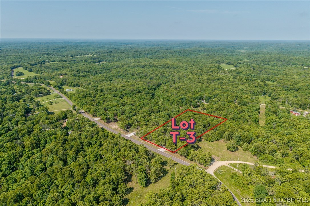 Excellent building lot consisting of 3.01 acres located on Ivy Bend rd (blacktop) just off of Hwy 135. Seller has just cleared all the under brush and installed a new rock driveway. Lot is ready to build and has electric poles on property. Minimal restrictions-All lots have been surveyed! Come stake your claim in a 3-acre parcel at beautiful Lake of the Ozarks today!