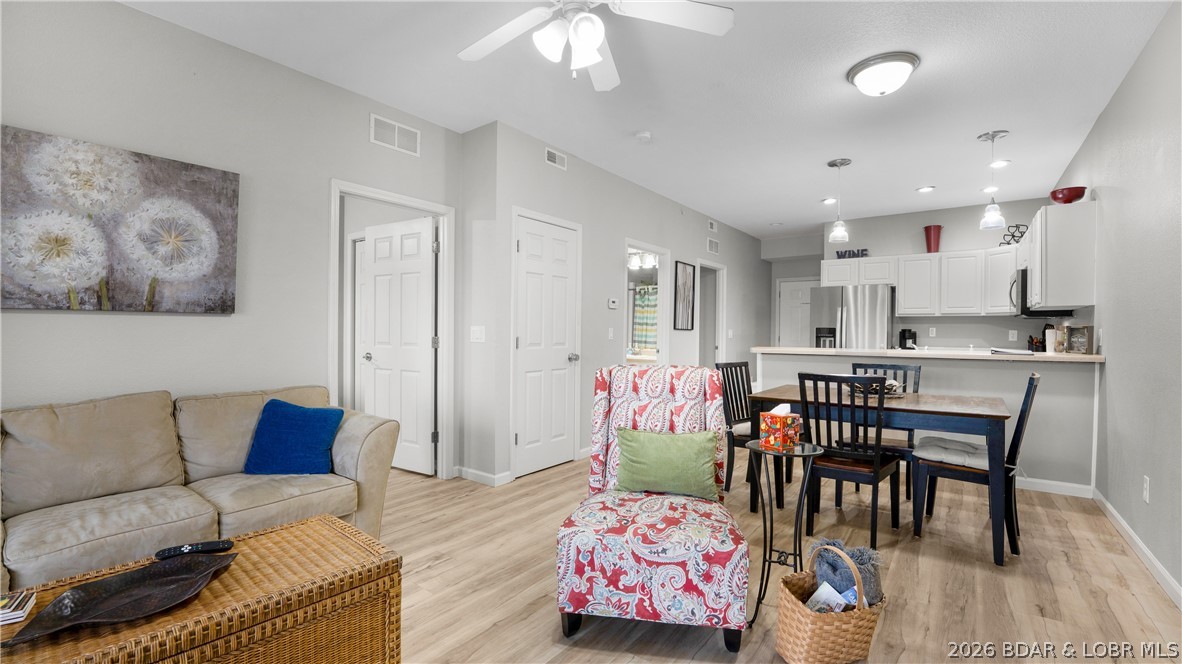 Located in the heart of Osage Beach on the Grand Glaize Arm at the 1MM — home of the exciting 2026 Shootout Boat Races — this updated lakefront condo places you in the center of all the Lake of the Ozarks action! Watch the races, boating activity, and breathtaking sunsets right from your private deck overlooking the main channel and your protected 16x40 boat slip, with an additional PWC slip included. Ideal as a full-time residence, weekend getaway, or investment opportunity, this turnkey property was remodeled in 2022 with new LVP flooring, fresh paint, and all-new stainless steel appliances, plus a new roof in Spring 2025. Amenities cater to lake lovers and anglers alike with an enclosed fishing dock, fish cleaning stations, year-round fishing, on-site boat ramp, trailer parking, picnic area with grills, and community pool. Conveniently located near shopping, dining, entertainment, grocery stores, and the hospital, this rare waterfront opportunity offers comfort, convenience, and endless recreation all in one. Ask about rental history and start enjoying lake life year-round — because life is simply better at the lake!