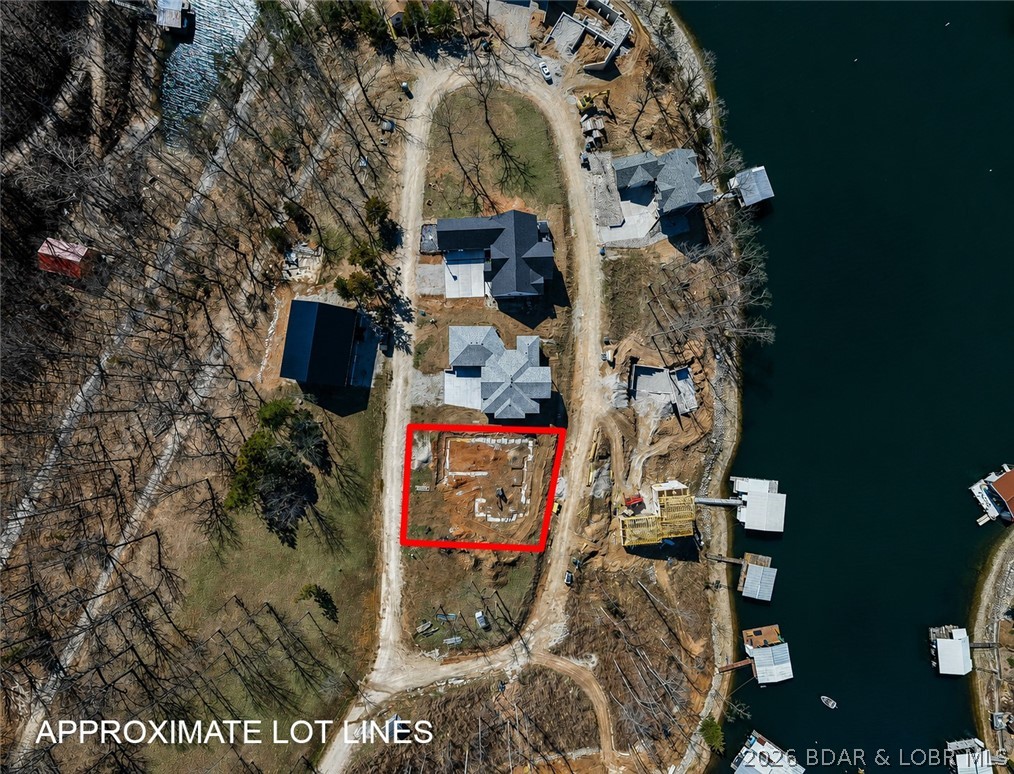 Footings have already been poured on this 1/4-acre lot overlooking beautiful Lake of the Ozarks in Los Breezes, the lake's newest waterfront development in Rocky Mount on the North Shore. Included building plans take the guesswork out of the construction process, providing a proven footprint while allowing you complete freedom to customize all finishes and personal touches to suit your style. The seller, an experienced builder known for quality craftsmanship and attention to detail, is also willing to provide a bid for a custom home build. This is a unique opportunity to streamline the building process while maintaining full control over the design elements that make a house your own. Don't miss your chance to create a custom lake-view retreat in one of the area's most desirable new communities.