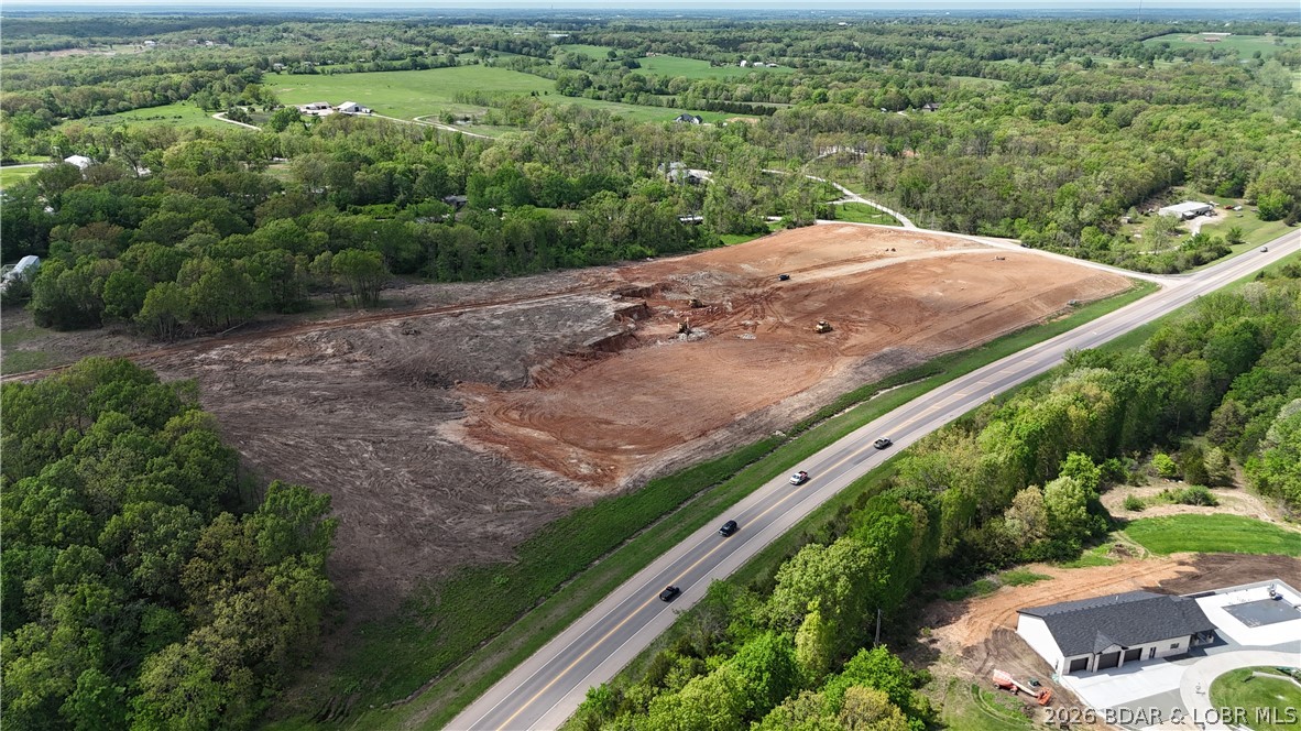 MASSIVE HIGHWAY EXPOSURE MEETS ULTIMATE FREEDOM. Situated just outside Eldon city limits, this expansive 20-acre tract steals the spotlight with over 1,000 feet of prime Business 52 frontage. The topography is a dream: all 20 acres are completely cleared, and 13 acres are perfectly leveled. The wallet draining work of wrestling with Missouri timber and rocks is done. It is shovel ready, tractor approved, and waiting for your vision.
With absolutely no restrictions, you enjoy total autonomy. There are no HOAs, no architectural reviews, and zero neighbors telling you what color to paint your mailbox. Whether you are planning a high visibility commercial storefront, a custom barndominium, or a hobby farm for your future alpaca empire, this high-traffic highway frontage ensures your project gets maximum eyes on it.
Capitalize on the heavy daily vehicle count while remaining minutes from Eldon amenities and the Lake of the Ozarks. This property provides the perfect balance of wide-open, cleared acreage and strategic highway access. Land with this much level, usable dirt and premium road frontage in Miller County is a rare find. Secure your footprint today!