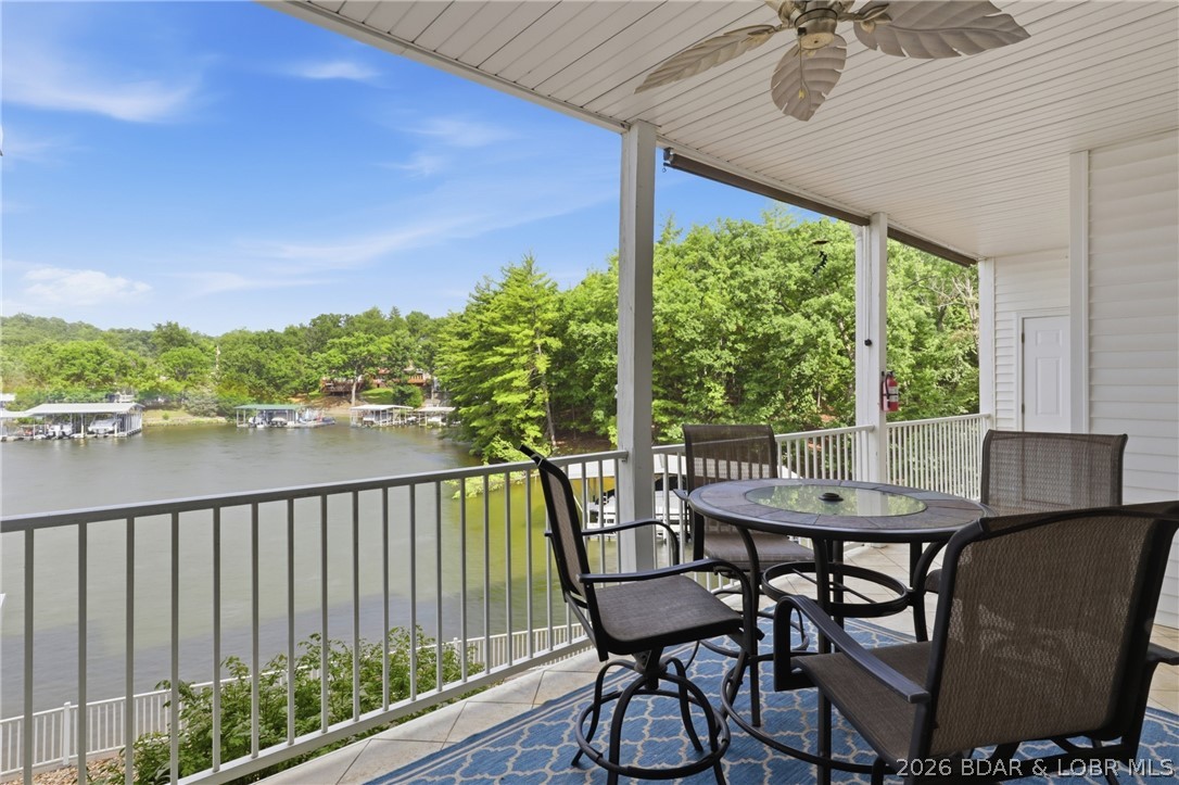 Leave the stairs behind and step right into effortless lake living. This immaculate walk-in level condo offers true no-step entry, sweeping views of the Osage Arm, and a protected cove at the 20-mile marker where unforgettable sunsets create the perfect backdrop. Fully furnished and move-in ready, this 3-bedroom, 2-bathroom condo is ideal as a full-time residence, weekend escape, or income-producing investment with nightly rentals permitted. Spend your days relaxing by the beautiful lakeside pool or enjoying the calm waters of the protected cove, then unwind by the electric fireplace after a day on the water. Included is a generous 14'x40' protected boat slip along with an additional PWC slip, so getting out on the water couldn't be easier. The complex also features convenient elevators and ample parking. HOA assessments cover cable, internet, dock reserve, water, sewer, trash, road upkeep, and exterior maintenance, making ownership simple and hassle-free. Just bring your suitcase and start making memories. The furniture, boat and PWC slips, sunsets, and lake lifestyle are already waiting. Schedule your private showing today!