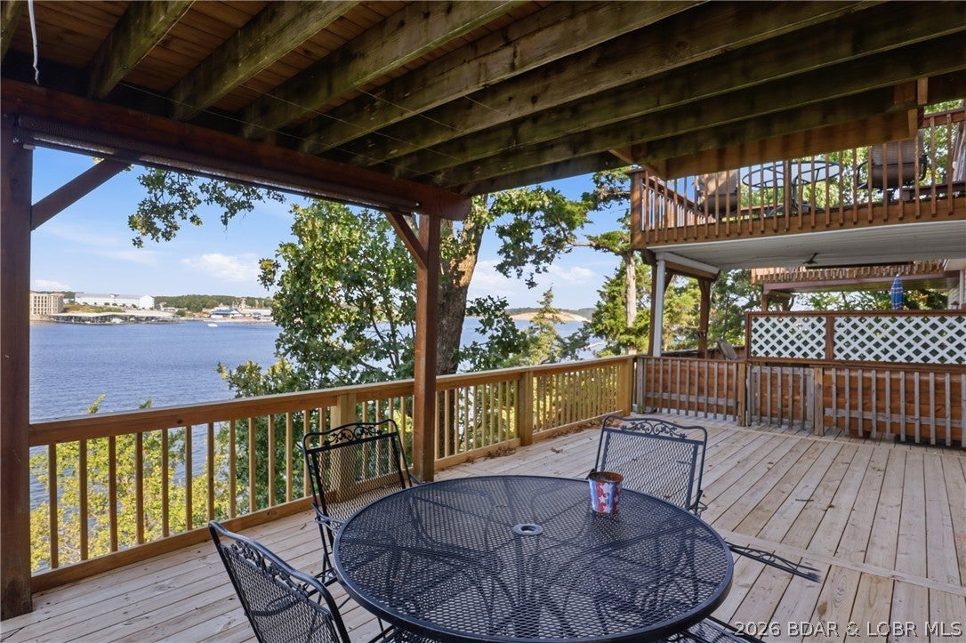LOCATION + VIEWS = Lake Life! This clean, ground-level 2-bedroom, 1-bath condo delivers the kind of lake views and location buyers dream about. Step outside to enjoy a huge outdoor space featuring new decking and railing—perfect for relaxing, entertaining, or soaking in those stunning views.

Located in the heart of Lake of the Ozarks, you're close to dining, shopping, boating, entertainment, and the exciting new Oasis at Lakeport amusement park. With a history of profitable returns, and turnkey with all furnishings this property is an excellent opportunity for an investor, while also being a fantastic option for a first-time buyer looking to own a piece of lake life.
