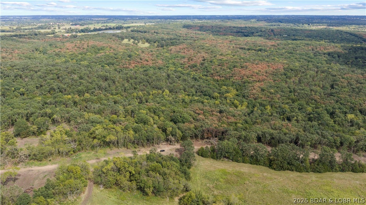 Tucked away just 4/10 of a mile off Highway 52, this exceptional 12.44-acre property offers the perfect blend of accessibility, privacy, and freedom. Situated near Big Rock Road directly behind the church and featuring a newly constructed access road, the land boasts a highly desirable level-to-moderate terrain that is ready for your vision. Best of all, there is no HOA to restrict your plans, giving you complete control over your estate. Enjoy the peace and quiet of a secluded rural setting while remaining just a convenient 10-minute drive from the heart of Eldon.