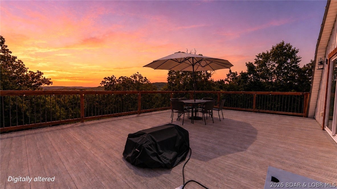 Privacy, space & move-in-ready living come together on just under 5 secluded acres at Lake of the Ozarks! Tucked away on a hilltop with blacktop all the way to the door, this unique remodeled home offers a peaceful setting w/ tons of wildlife and plenty of room to spread out. Main level is designed for easy one-level living w/ a spacious primary suite, dual closets & an impressive primary bath (huge tile walk-in shower). Large kitchen featuring abundant cabinetry & huge pantry, butcher-block island & reverse osmosis, plus LVP flooring & 10' ceilings. Upstairs adds 2 bedrooms, full bath, 2nd laundry, family room (or convert to a bedroom if needed) & a large deck w/ breathtaking sunset views AND for watching summer fireworks! Recent improvements include newer HVAC, mini-splits, COMO fiber internet, new water heater & water softener, newer well components & septic replaced in 2022. Outside offers a circle asphalt drive, concrete patio out back w/ firepit, garden area (fertile soil for fruits, veggies & flowers), chicken coop & room to add a shop/garage. Large flat building spot off drive-way is a great area for large shop/multipurpose building. No HOA & surrounded by privacy=Freedom!