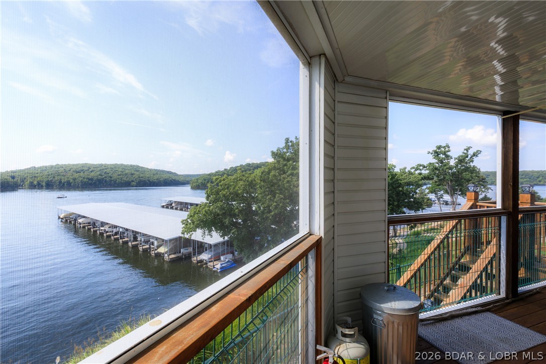 LAKE DAYS JUST GOT EVEN EASIER! Brand-new steps have been added from the back deck, giving you quick, convenient access to your private 10x24 boat slip—be on the water in minutes! Located in the highly sought-after State Park area, this first-floor 3-bed, 2-bath condo offers the perfect blend of comfort, convenience, & lake living. Inside, you'll find durable LVP flooring, stainless steel appliances, a spacious screened-in porch, & tasteful furnishings throughout. Best of all, it's being sold fully furnished, making it completely turn-key for your own getaway or your next investment property. Walk right out your back door to spend the day on the water, then unwind on the deck while taking in breathtaking State Park views & unforgettable sunsets that will remain protected for years to come. Need more room? A 12x30 boat slip and a rare two-car garage are available for an additional cost. The amenities here feature a community pool, clubhouse, fitness center, walking trails, playground, golf cart-friendly roads, expansive trailer parking, on-site property management and maintenance, and short-term rentals are allowed. This property delivers the lake lifestyle you've been dreaming of.