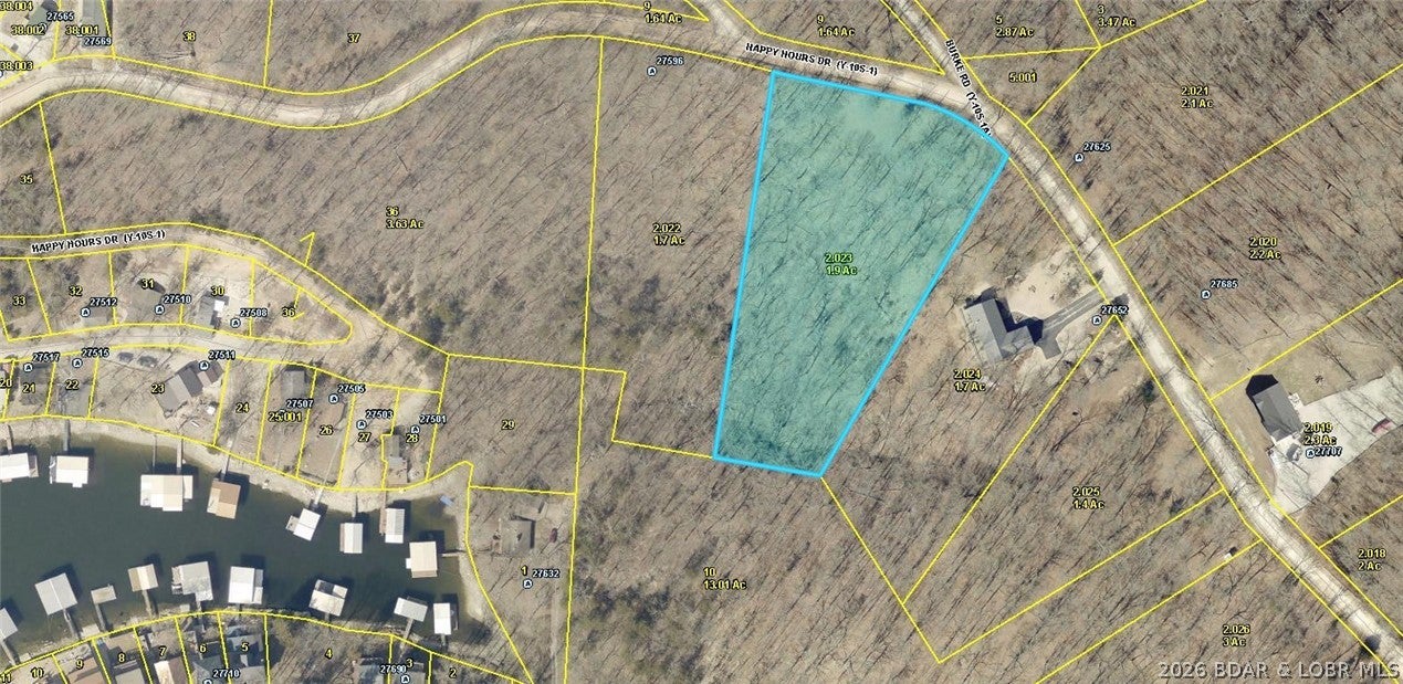 1.9 Acre Building Lot with Seasonal Lake View. Wooded Lot has Electric close by. This is the perfect country setting to build your dream home in this spacious and quiet subdivision with well maintained roads. Community water and sewer available. Located minutes from Jolly Rogers Restaurant and only 20 minutes to Lake of the Ozarks Famous Bagnell Dam Strip for Shopping, Restaurants & Entertainment. Home & extra Lots also for sale.