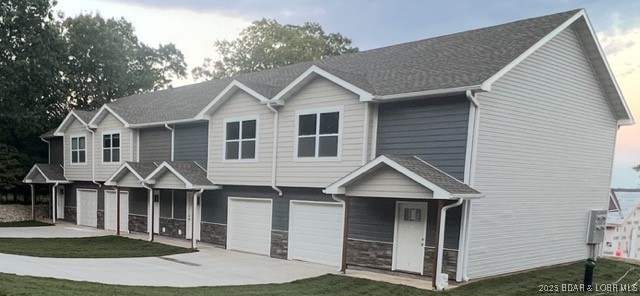 This New Construction 28 Unit Complex is conveniently located in the Heart of the Lake - midway between Osage Beach and Camdenton. This complex will have seven buildings, complete with 4 units each. Your low HOA fees will include central sewer, water, lawn care, pool, trash and road maintenance. The new community pool is completed and ready for your enjoyment! Each townhome offers 3 bedrooms, 2.5 bathrooms and upgraded finishes such as LVP flooring throughout the main living areas and granite countertops. You'll enjoy the attached one car garage as well as the back patio for cookouts. The large master suite offers a walk-in closet and master bath. Laundry is located on the upper level near the bedrooms for your convenience. You'll love the upgraded finishes throughout this home! VA Approved and One Year Builders' Warranty offered on each unit.