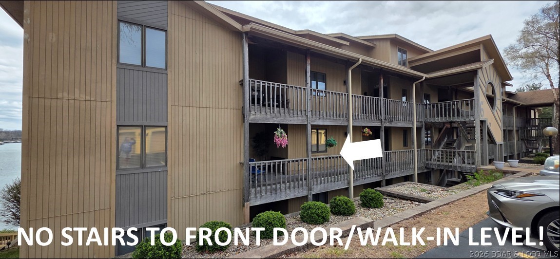 HUGE REDUCTION! LAKE OF THE OZARKS! SELLER OFFERING TO PAY 1ST YEAR HOA DUES FOR BUYER! Boating Season is here! RUN... DON'T WALK... deals like this don't come along very often! PARKING LOT LEVEL Condo (no stairs to front door) WITH a 40 foot long covered cruiser BOAT SLIP on MILE MARKER 10 with a BEAUTIFUL VIEW OF THE LAKE! It comes TURN-KEY, FURNISHED, MOVE-IN READY! As is. All you need to bring is your tooth brush and swimming suit! Included in sales price: remote controlled boat lift w/ tandem storage for 2 waverunners alongside where you would park your boat. Boat dock is covered, has electricity, and water for cleaning the boat in a cove location with year-round deep water and protected by wavebreaks. Ranch unit with open spacious floorplan! Kitchen has been updated with TWO REFRIGERATORS, deep pantry w/ spin-out storage shelves for easy accessibility, newer granite counters, oversized composite black granite sink, and breakfast bar seating open to the dining room. Both baths have been updated! New jetted tub with new tile surround! Updated flooring! See the extensive list of amenities covered by the HOA in the attached supplements!