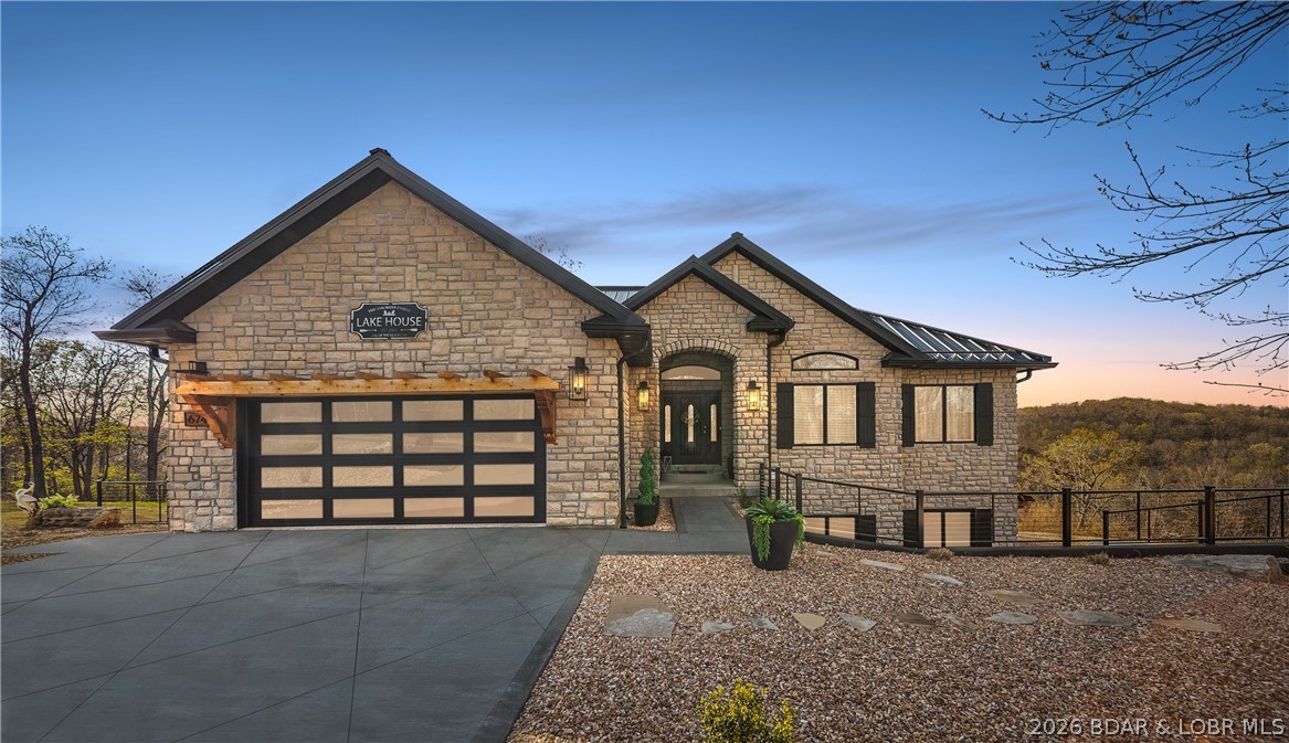 Tucked into a private setting in the heart of town, this stunning home offers year-round lake views and 3 acres
with no HOA—perfect for relaxing, entertaining, or expanding. The spacious layout features 6 bedrooms, 4.5
bathrooms, two living areas, a safe room, and two laundry rooms. Enjoy two luxurious primary suites with spalike baths and high-end showers. A standout feature is the versatile basement en suite, ideal for a guest suite,
man cave, workshop, or creative space. Recent upgrades include new garage doors, fencing, ceiling fans,
interior lighting, new granite on the kitchen island, a double oven and more. The finished, climate-controlled
garage feels like an extension of the home, complete with modern finishes, dark accent walls, rich wood
flooring, updated lighting, and built-in shelving—perfect for car enthusiasts or collectors. Level, usable acreage
offers endless possibilities to add a pool, shop, or more. Luxury, privacy, and convenience come together in this
rare property.