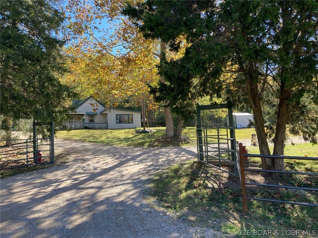 Truly a gem of country living! W/ a 4 stall barn w/ tack room, bathroom, and new full loft! Dry lot, multiple pastures, extensive fencing, & an additional 1 Bed, 1 bath cabin with separate private entrance & fully fenced yard, this property features everything the future homesteader could desire! Main home features 3 beds & 1 bath, located quietly on Knobby rd w/ road frontage on two sides, & creek frontage running the the west side of the property. With 28 FLAT acres, management of your livestock is simple, with trails running throughout the property. One of the outstanding features of the property is over 2000 ft of Rainey Creek frontage, featuring babbling brooks and swimming holes to rest after tending to your herd or flock. Located close to Lake of the Ozarks and Harry S. Truman Reservoir  you have access to some of Missouri's best boating, fishing, and outdoor living! With the city of Climax Springs and Edwards both within fifteen minutes, you get to have the peace and privacy of country living without ever going without. Whether you are looking for a homestead or just a slice of paradise, you are not going to want to miss out on this outstanding opportunity!