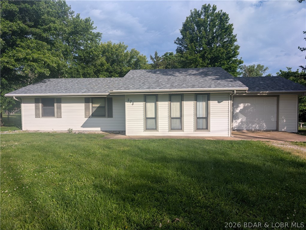 This home is a wonderful one-level gem waiting to be found. It is located in Camdenton, MO, with easy access to Lake of the Ozarks, MO. The right person, family, or couple will love the large, very level backyard. There are several already established plots for flowers or a garden area in the back. It could be a great place for Volleyball or any outdoor sport. The one-level home affords ease of access to all the rooms, and has an open floorplan- making it seem very roomy....Need a home without stairs and ins and outs- this is the ticket...This home is a darling little sweet spot right off of Ballpark Road in Camdenton, MO. Bring your own creative ideas and move in soon- this won't last long at this price....