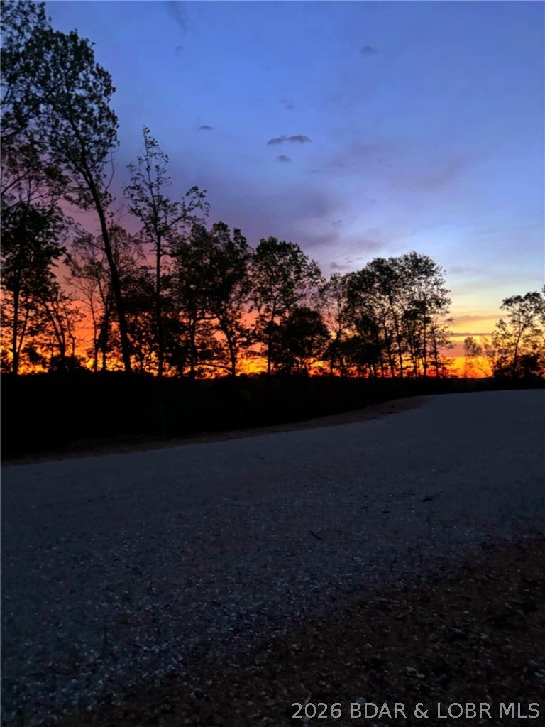 This timbered Ozark tract offers a versatile piece of land approximately 1.5 miles from Lake of the Ozarks. Rolling hills, mature timber, and diverse habitat create the setting for a property that can serve recreational, residential, or investment interests.

The wooded terrain provides habitat and natural travel corridors for whitetail deer, turkey, and other wildlife common to the region. For the outdoor-minded buyer, the property offers opportunities for hunting, hiking, exploring, and enjoying a private tract of Ozark land.

Beyond recreation, the property features potential home building sites positioned throughout the timbered landscape. Its combination of location, acreage, terrain, and buildable areas also creates an investment and development opportunity. Whether considered for a homesite, recreational getaway, future building tracts, or a long-term land investment, this property offers several potential paths for future use.