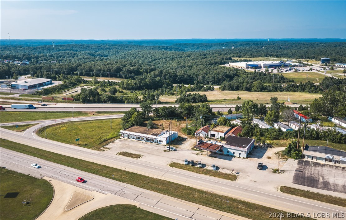 This outstanding 2.04 m/l acre commercial opportunity in the heart of Pulaski County, Missouri, ideally located on historic Old Route 66 just minutes from the main gates of Fort Leonard Wood. With excellent visibility, this property offers exceptional potential for a wide variety of commercial uses. Situated just off Interstate 44, the property benefits from exposure to an area traveled by approximately 40,000 vehicles per day, providing outstanding access for customers and commuters alike. The location is surrounded by major national retailers and restaurants, making it an ideal location for commercial opportunities. This property was formerly operated as a gas station. The underground fuel storage tanks and fuel pumps have been removed, and the seller will provide documentation related to the tank removal and environmental project for buyer review. The property also includes several older buildings that are in need of demolition. Whether you're looking to expand an existing business, develop a new commercial venture, or invest in one of the fastest-growing commercial corridors in the region, this property checks all the boxes.