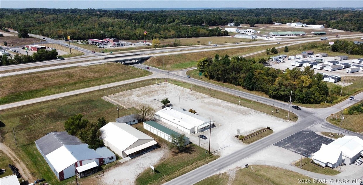 Commercial building and large tract located at the corner of 65 Hwy and Truman Dam Access Rd. and Commercial St. in the heart of the business district. Within minutes of Truman Lake and Lake of the Ozarks, this first-class commercial building offers space at one of the busiest locations in Warsaw. Setting on a well taken care of 2.48 acres, this prime commercial building boasts 5,472square feet, ample parking and a chance to take advantage of being close to Walmart, Dairy Queen, McDonalds, Subway, Taco Bell and Truman Dam. The possibilities are endless with this building. Don't wait! Get your business established before the fishing tournaments and boutique crawls, and all the spring and summer festivities Warsaw has to offer get started!