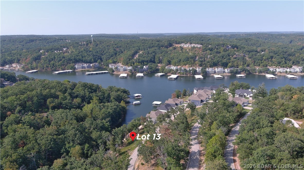 Amazing opportunity to purchase seasonal lake front lot in a well established subdivision. This lot will allow you to build a private home or a Villa in the Villas of Tuscany Subdivision. This location is one of the most ideal lots within the subdivision. Amenities are already in place with water & sewer, internet access through Spectrum. You will enjoy the amazing pickle ball court, community pool & bath house, and golf cart path down to the community docks. Note- proposed structure shall be approved by Architecture Review Committee and landscaping will also need to be approved. (Subdivision will maintain landscaping of home, just as a Villa). Buyer to verify hook-up fees to water & sewer. Great opportunity to build your dream home that allows for some maintenance free lake enjoyment or a Villa for yourself or for investment. Wonderful location by land and water.