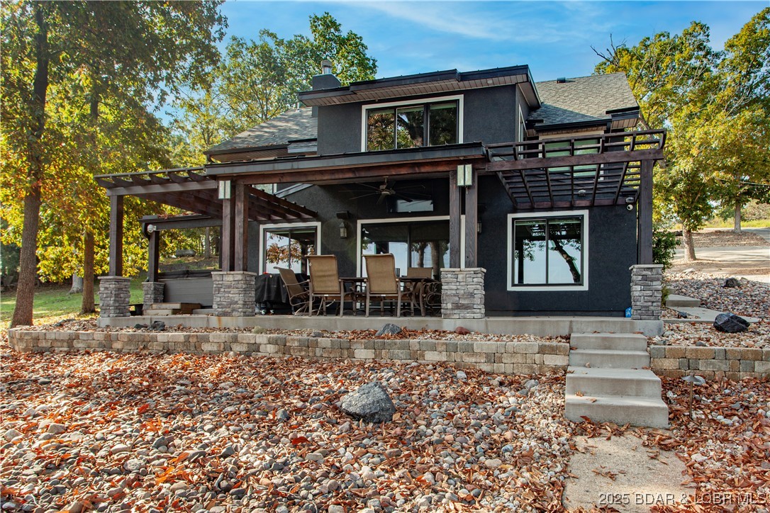 OPEN HOUSE Saturday and Sunday JUNE 27-28 1-4 PM GORGEOUS!!!  Sunshine and Water....Lakefront living at its finest! Spectacular vies of water! This totally remodeled 5-bedroom, 4-bath home at the 54 MM offers nearly 2,900 sq. ft. of beautifully finished space with a very open layout. No detail has been overlooked—new roof, mechanicals, appliances, drywall, and designer finishes throughout make this home truly move-in ready. Enjoy stunning views from both levels with a walkout basement and a  spacious patio/Covered.  A covered area where the Hot Tub sits is also a nice relaxed area. A gentle walk takes you right to the water’s edge, and stone fireplace with seating.  You’ll find a two-well dock (12x32 and 10x32), complete with boat lifts. Two PWC slips are also available and negotiable. The property includes a detached one-car garage, perfect for storage of lake toys or equipment. Whether you’re looking for full-time living or the ultimate getaway, this home has it all. You won’t be disappointed! With full price offer all items are included in the included section.