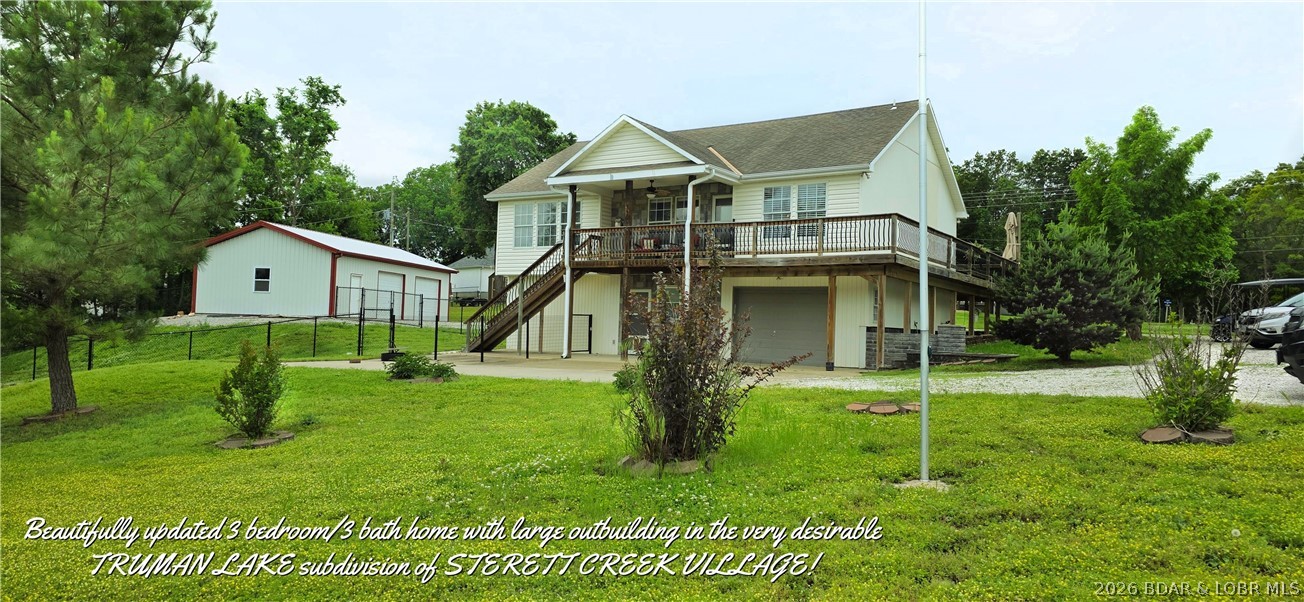 Beautifully updated 3 bdroom 3 bath home with large outbuilding in the popular TRUMAN LAKE subdivision of STERETT CREEK VILLAGE! Living room features gas fireplace, access to wrap around porch with stunning views of the Ozarks. Kitchen offers custom cabinets, granite countertops & newer stainless appliances. Master suite includes newer walk-in shower, soaker tub, double sinks & walk-in closet. Walk out lower level boasts of large family room with sleeping area, large closest &3rd bedroom/office with full bath. Large lower entry area off the 14x27 deep garage. Beautiful wrap around deck partially covered. 34 x28 shop will hold a large boat, trailer & vehicles. Shop includes concrete floor, electric, 10x28 workshop &2 garage door openers. This oversized lot features chain link fenced backyard, huge slab for extra parking & a 10x12 storage building with loft. Not enough? Wonderful neighborhood amenities include community pool, pickle ball & basket ball courts & full access to the marina & restaurants. It's never to late to buy that lake home you have always dreamed of. No better place to live out that dream, than the lovely lake community of Sterett Creek Village!
