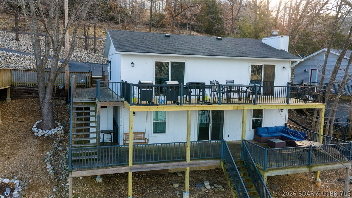 Beautifully updated 3 bed, 2 bath lakefront home at the 3MM in a fantastic deep-water cove! This property offers an expansive dock envelope and a concrete dock with a 12x32 slip plus two PWC slips—perfect for maximizing your lake time. The walk-in level features two bedrooms, a full bath, kitchen, dining area, and comfortable living room. The kitchen shines with stainless steel appliances, granite countertops, and LVP flooring. Downstairs you’ll find a second living area with lake views (easily converted to a 4th bedroom), a dry bar with fridge, an additional bedroom and bath, laundry, and storage. Outdoor living is a dream with a spacious two-tier deck AND a new upper deck, offering plenty of room to entertain and relax on summer nights. Updated in 2020 and selling fully furnished, this home is truly turnkey. Nightly Rentals are allowed so if you are searching for a great investment this is it! Schedule your showing today and start enjoying lake life right away!
