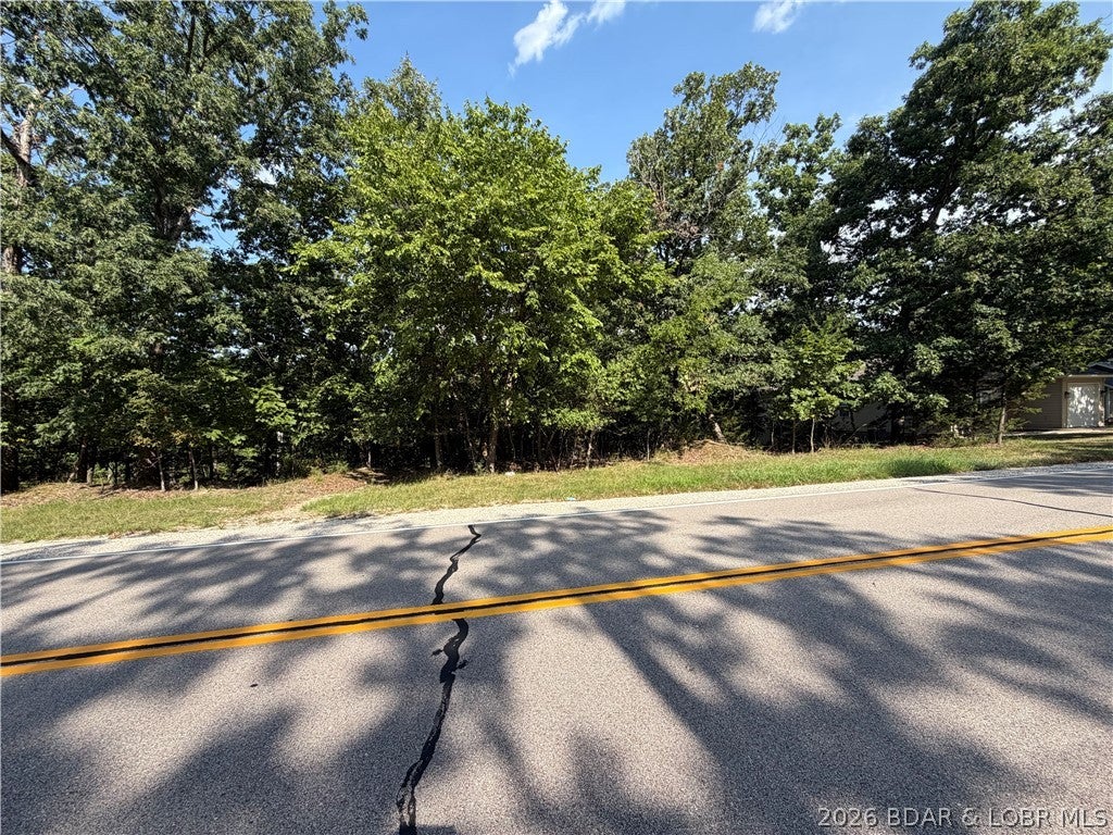 Attention builders and future homeowners—this is the opportunity you’ve been waiting for in the heart of Four Seasons! Ideally positioned on a desirable corner just off Cherokee Road, this affordable homesite offers convenient road access and the gentle, nearly level topography that is becoming increasingly difficult to find at the Lake of the Ozarks. Whether you’re planning your next spec home, a full-time residence, or the custom lake-area retreat you’ve always envisioned, this lot provides an excellent building canvas with fewer of the challenges associated with steep terrain. Ownership includes access to the amenity-rich Four Seasons community, featuring multiple swimming pools, the impressive Aquatic Center, playgrounds, tennis and pickleball courts, basketball, bocce ball, community boat ramps, stocked interior fishing lakes, a campground, community center, fitness center, and miles of walking and biking trails. Enjoy an unbeatable location close to shopping, dining, golf, entertainment, and everything the lake lifestyle has to offer. Affordable, buildable lots with this combination of location, topography, and amenities are getting harder to find.