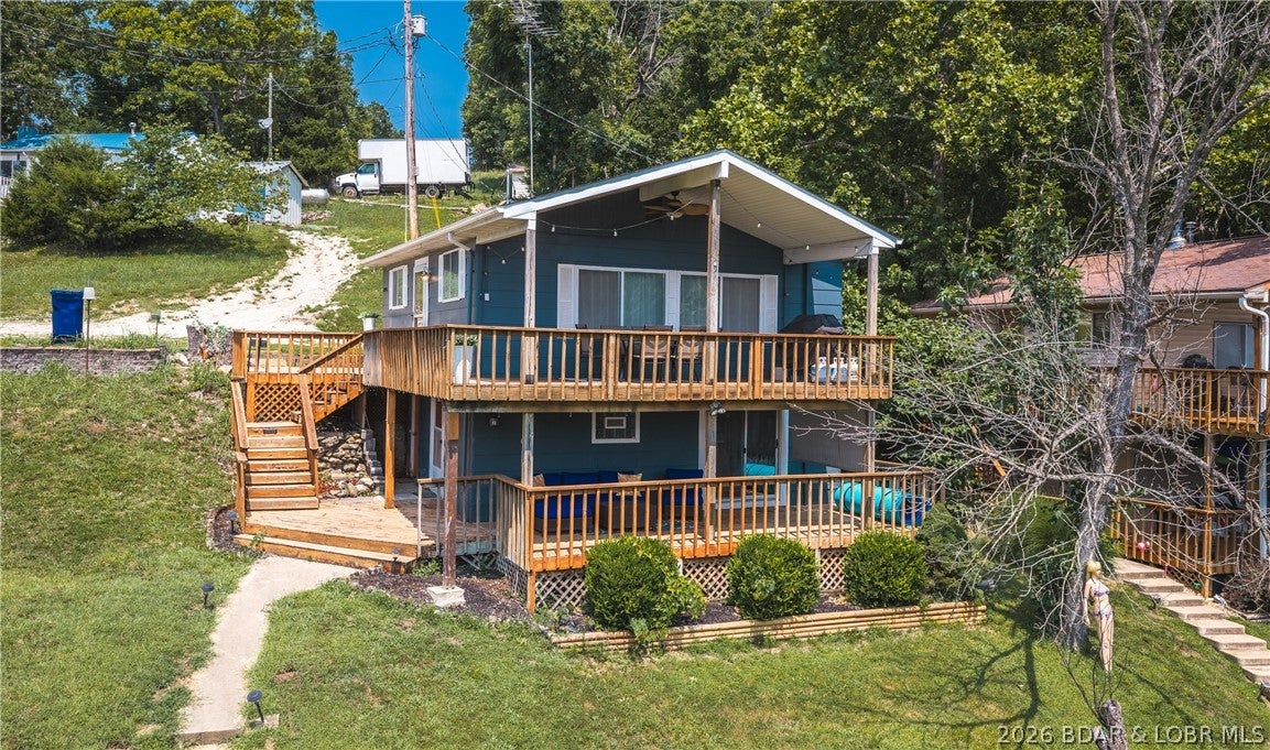 Wake up to breathtaking lake views & experience the perfect blend of modern luxury & relaxed waterfront living in this beautifully remodeled (2025), fully furnished 3-bed, 2-bath home. Every detail has been thoughtfully updated with stylish finishes, creating a move-in-ready retreat that's equally suited as a full-time residence, weekend getaway, or investment opportunity. Previously operated as a successful part-time Airbnb, this property offers exceptional flexibility. The bright, inviting interior features elegant quartz countertops, contemporary finishes & a lower level with a private bedroom & a bathroom showcasing a floor-to-ceiling tiled walk-in shower. Step outside to wraparound decks on both the main & lower levels, providing the perfect setting to enjoy morning coffee, entertain guests or unwind while taking in the lake views. Spend your days on the water with your own private dock featuring a 10x28 boat slip, making boating & fishing just steps from your door. Being sold fully furnished, this exceptional property is truly ready for you—or your guests—to start enjoying from day one. Schedule your showing today & start living the lake lifestyle you've been dreaming of!