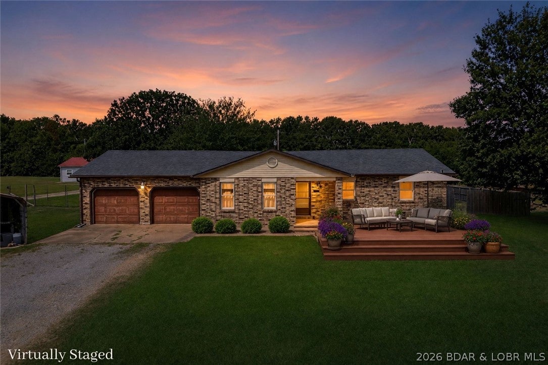 Enjoy the freedom of country living without giving up everyday convenience! Situated on 1.9 acres just off BB & Highway 5, this  1,600sqft home offers a peaceful setting only 10 minutes from Lebanon & 20 minutes from Camdenton. Located on a quiet dead-end street, the property features 3 beds, 2 baths, hard-surface flooring throughout, and plenty of space both inside & out. With no HOA & no restrictions, you’ll have the flexibility to make the property your own. The large, fenced backyard provides a place for children & pets to play while offering plenty of room for gardening, outdoor entertaining, or even adding the swimming pool.  An attached 2-car garage provides convenient parking and additional storage, while the separate carport adds even more versatility. Equipped with a 50-amp electrical hookup & water connection, the carport is ideal for a camper, additional vehicles, or a future workshop area. With nearly two acres, generous parking, a fenced yard, and a location that offers easy access to Hwy 5, this property delivers the space and flexibility that can be difficult to find. Bring your pets, park your recreational vehicles, and enjoy fewer limitations, this one is for you!