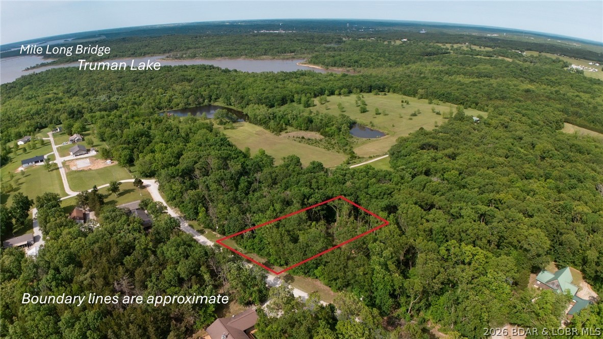 Enjoy the view of Truman Lake and the Mile Long Bridge! Beautiful 1.07 +/- Acres in Whispering Winds Estates, a gated subdivision near Truman Lake. Community well access is available, with electric conveniently located at the road. With peaceful surroundings, easy access to boating, fishing, and outdoor recreation at Truman Lake and close proximity to downtown Warsaw, this is the perfect spot to build your dream home!