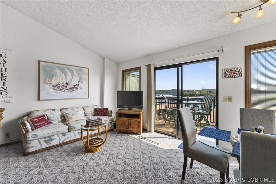 Top-floor living w/vaulted ceilings & unforgettable main channel views—this is the kind of condo buyers wait for. Perfectly positioned to capture a main channel view, offering a front-row seat to everything the lake has to offer. Equally impressive is the effortless lake access, with your boat slip located directly in front of the condo—no long walks, just quick & easy days on the water. The unit has been updated featuring newer HVAC, hot water heater, paint, stainless appliances, new decking & railings, creating a fresh, low-maintenance outdoor space to relax & take it all in. This is a rare opportunity within a highly sought-after, gated community that offers an exceptional lineup of amenities, including both indoor & outdoor pools, hot tub, playground, basketball & tennis courts, boat ramp & the convenience of onsite property management. Most desirable building at SWS, close enough to the pool, without a parking problem. Adding to its appeal, this condo has been lovingly owned for 22 years—a true testament to the quality of the development & the lifestyle it offers.The couches are sleeper sofas, so there is plenty of sleeping room! Opportunities like this don’t come along often.