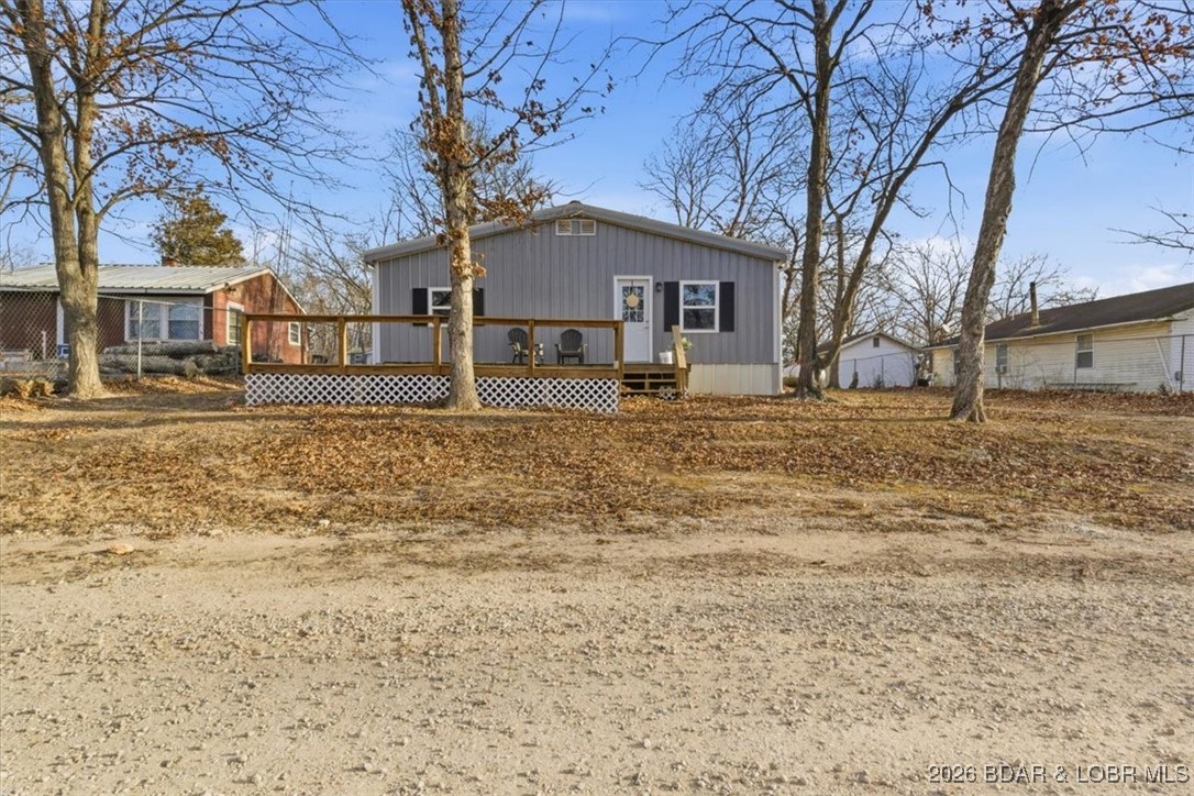 Beautiful FULLY remodeled 2 bedroom 2 bathroom 2nd tier lake home. Convenient one level living! Relax while sitting on your deck while enjoying the beautiful views of the Lake of the Ozarks. This home is perfect for summer getaways! Lake access and available boat slips at Surfside Bay Resort, just walking distance from this home, as well as NO HOA!! 2 car garage is perfect for storing boats and water toys, as well as doubling as a workshop.