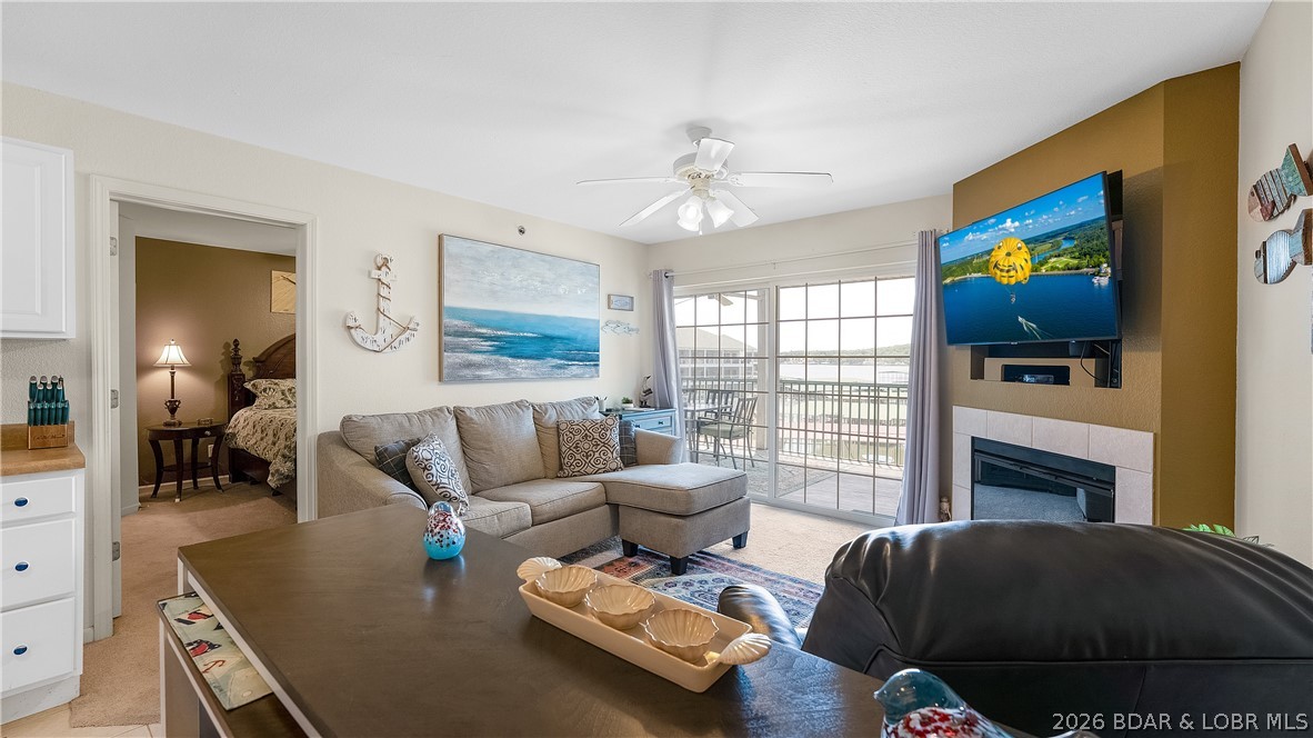 Don’t miss this furnished 2BR/2BA condo at Highland Shores—an ideal lake getaway, full-time home, or investment opportunity! Outstanding central location on the 14 MM by water and at the beginning of Horseshoe Bend for easy in and out during the season. Overlooking the pool, this unit also features two lakefront bedrooms, each with sliding doors leading to the expansive screened porch for effortless indoor-outdoor living. The porch has a storage closet to keep all your lake toys and walks off to a grassy area, which is a rare find in condo living. Turn-key with the furnishings included, so you can start enjoying it right away. 11 x 34 boat slip lease is annual for $3,000 with a 10,000 lb lift available for extra $. Highland Shores is a desirable smaller complex with only three buildings and low HOA fees, offering a peaceful setting in a prime location close to the best restaurants, shopping, grocery stores, golf, and quick highway access. If no steps is a must, there is elevator access in the building next door.  Priced to sell and with the amenities, location, and move-in-ready appeal, this is the kind of condo buyers wait for—schedule your showing today before it’s gone!