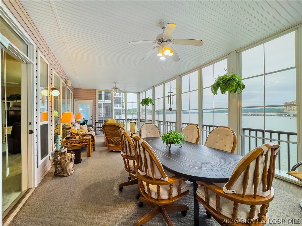 WOW! WHAT A VIEW! THIS CONDO SITS ON THE WATER’S EDGE AT LAKE OF THE OZARKS, CLOSE TO SHOPPING, GOLF, RESTAURANTS, AND HOSPITAL. EFFECTIVE 7-1-26 REDUCED $25,000 dollars, PLUS A TWO CAR GARAGE INCLUDED IN PRICE and  FURNISHINGS. No boat docks block your views here, and the water is quiet for swimming and water skiing. This is a small condo complex with only 18 units, and rentals are not allowed. The unit has been updated with granite countertops in the kitchen and updated cabinets in the baths. Also, this condo has been updated with a completely enclosed porch, adding square footage for additional living space. The unit comes with a 12' x 28' Boat slip and lift, plus a PWC slip. OWNER HAS ADDITIONAL BOAT SLIPS for additional dollars. The Horizons also has a fish-cleaning station and 3 docks. YES, THERE IS MORE: INCLUDED HOW IS A TWO CAR GARAGE WITH AN OVERHEAD FLOORED ATTIC FOR ALL YOUR WATER TOYS AND A WORK BENCH WITH PEGBOARD FOR TOOLS. OWNER IS MOTIVATED!!