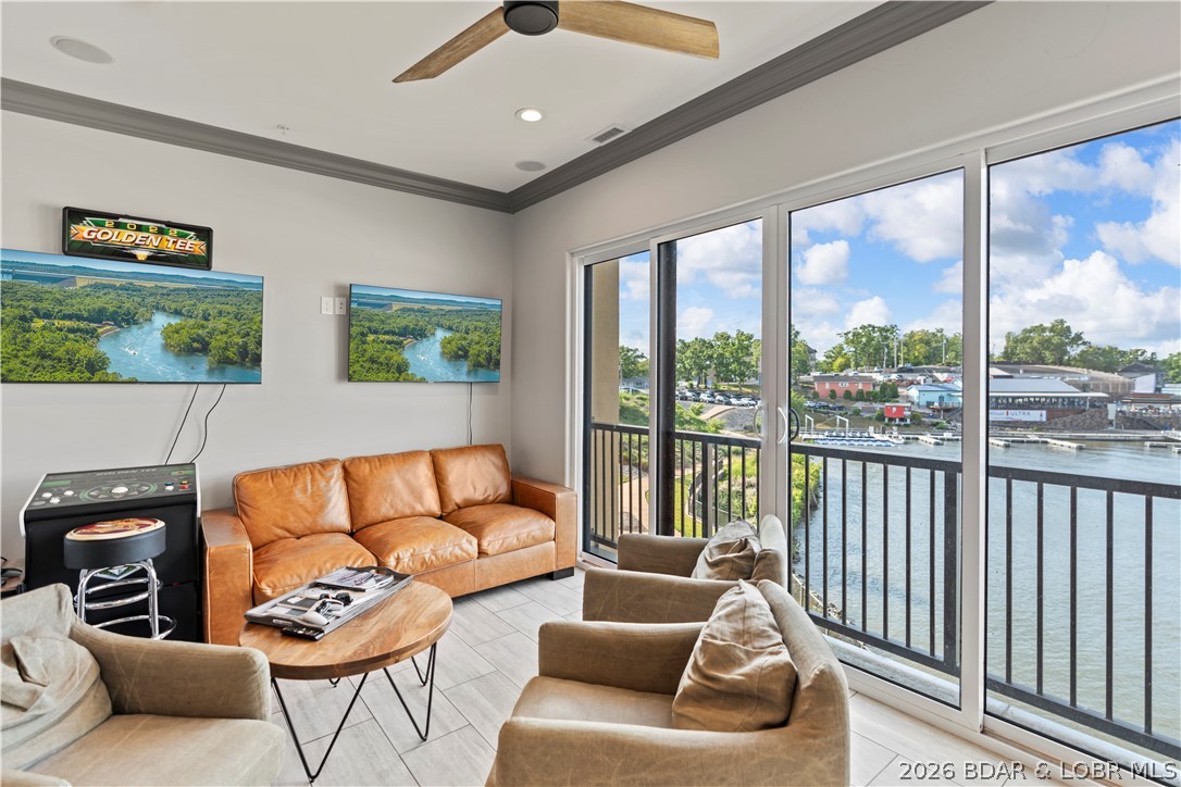 Walk-in level lakefront condo at The Hamptons in Osage Beach offering direct, stair-free access and convenient proximity to community amenities. This thoughtfully designed residence features an open-concept layout, abundant natural light, and custom built-in bunk beds to maximize sleeping capacity for guests. The interior showcases a distinctive design palette that sets it apart from typical neutral finishes. Enjoy access to the extensive amenities available within The Hamptons community, including a clubhouse, fitness center, pool, and lakefront recreation areas. Boating enthusiasts will appreciate the exceptional dock options, including 32', 48' and 60' slips, providing space for multiple boats and watercraft. Located in the heart of Osage Beach at Lake of the Ozarks, this property offers convenient access to shopping, dining, golf, marinas, and year-round entertainment. Priced below comparable new-construction opportunities within the newest phase of the development, this condo presents a rare opportunity to own a lakefront property with premium boating accommodations and resort-style amenities. Ideal as a full-time residence, vacation retreat, or investment property.