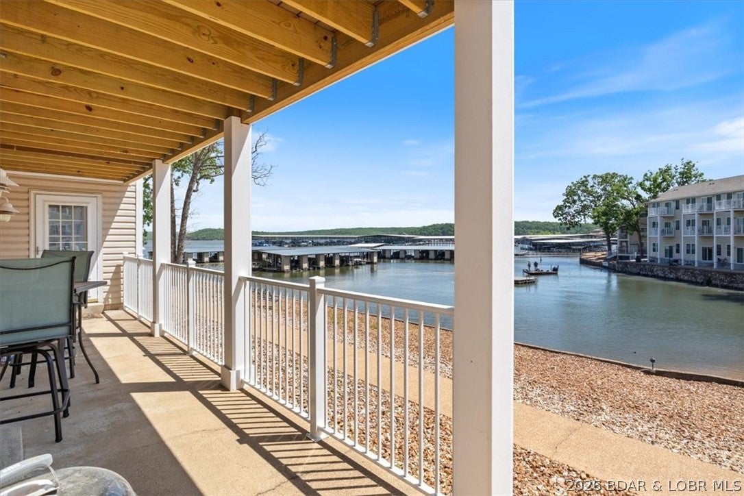 Beachfront living in the heart of Osage Beach! Located in highly desirable Kapilana Estates - where nightly rentals are allowed. This beautifully maintained 3-bedroom, 2 bath condo offers the perfect blend of lake lifestyle and income potential. Just minutes from Dog Days Bar and Grill, Twisted Tonys, Chevy's and the Grand Glaze bridge where the New Oasis is being built!! You'll love being in the center of it all! Enjoy lakefront access with just steps away from the community pool. Inside, the spacious kitchen features abundant cabinetry, a center island, and an open-concept layout that flows seamlessly into the living area - ideal for entertaining or relaxing after a day on the water. Take in stunning Lake of the Ozarks views, stroll the shoreline, and enjoy the convenience of two 10x24 boat slips perfect for lake lovers and guests alike. Whether your looking for a personal getaway, full time lake retreat, or a highly desired investment property, this condo truly checks all the boxes.
