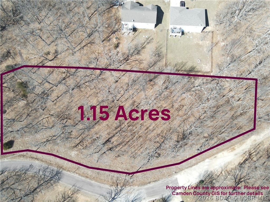 Discover an incredible opportunity in **Camelot Estates** in the heart of **Lake of the Ozarks**! These two adjoining lots on Ashton Lane are being sold together, offering the rare chance to build right on the lot lines and create one expansive homesite tailored to your vision. Even better—the two neighboring lots are also available, giving you the potential to own the final four lots at the end of the street for unmatched privacy and minimal drive-by traffic.

With four lots combined, you could construct a second structure such as a detached garage, workshop, or even an additional home—ideal for multi-generational living or extra storage for all your lake toys. Water, sewer, and gas hookups are available, making your build process even smoother.

Enjoy close lake access with nearby boat ramps and a conveniently located marina. Camelot Estates amenities include a boat ramp, boat trailer parking, campground, clubhouse, community pool, road maintenance, and tennis courts. Secure your slice of lake life and build exactly what you’ve been dreaming of! Call Matthew Loftis at 573-286-5732 for more information!