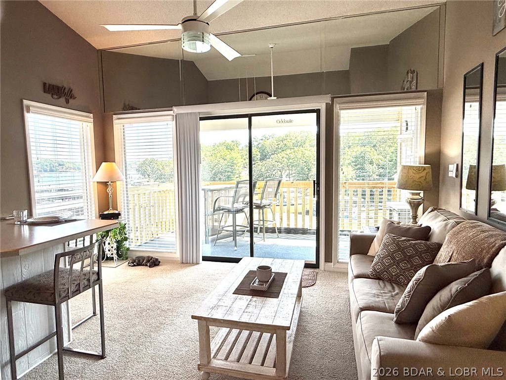 Hurry! so you don't miss out on this Beautiful top floor end unit.  Outstanding Main Channel view while your dock is cove protected.  
Enjoy the morning sun on the covered deck but enjoy the shade in the evenings..  Turn on the ceiling fan on the covered deck and enjoy the lake view in all types of lake weather.  New deck railings installed and when painting is complete you can put the screen enclosure back up if you desire. This unit features vaulted ceilings in the Living Room, Bedroom and on the deck.  This unit shows like a model and will make a great lake getaway.  Being sold as Turn Key so you can easily spend your first night enjoying the lake.