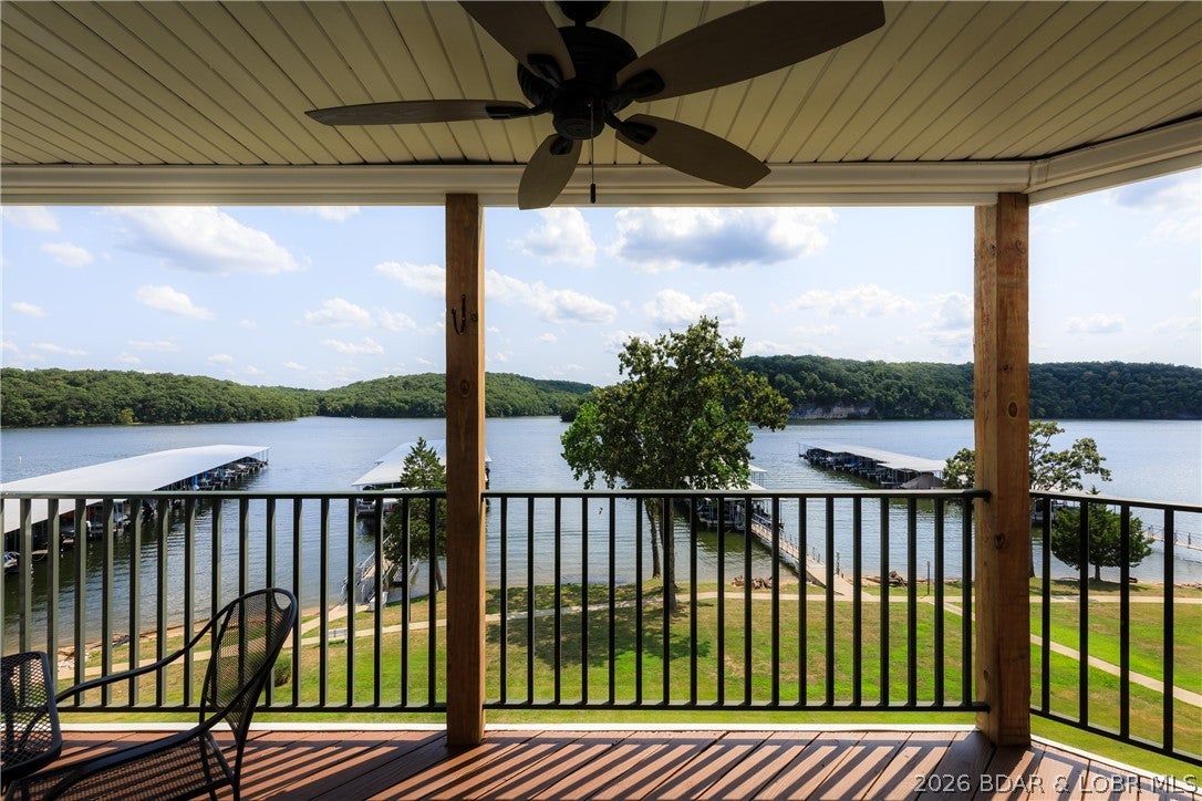 Live the ultimate lake lifestyle inside the State Park! This turn-key 2-bedroom, 2-bathroom condo sits on the calm Grand Glaize arm, offering spectacular views of the water and natural park cliffs right from your deck and lakeside master bedroom. Located just one flight up for easy access, this incredible package comes ready for the water from day one: a 12x30 boat slip, a boat hoist, plus a covered PWC space for your personal watercraft. Plus they are throwing in the boat! Best of all, you are just a short, convenient boat ride to the lake's premier dining and entertainment hotspots, including Dog Days Bar & Grill, Shorty Pants Lakeside Cajun Restaurant, Redhead Lakeside Grill and Yacht Club, and Backwater Jack's! Want secure storage for your gear? A highly coveted garage right outside the condo door is available for purchase as well. The community features a sparkling complex pool and a clubhouse with fitness room. Step outside to explore the state park’s sandy beach, miles of scenic hiking and biking trails, and public boat launch. Great investment opportunity. Dreams to Reality! Call Today!