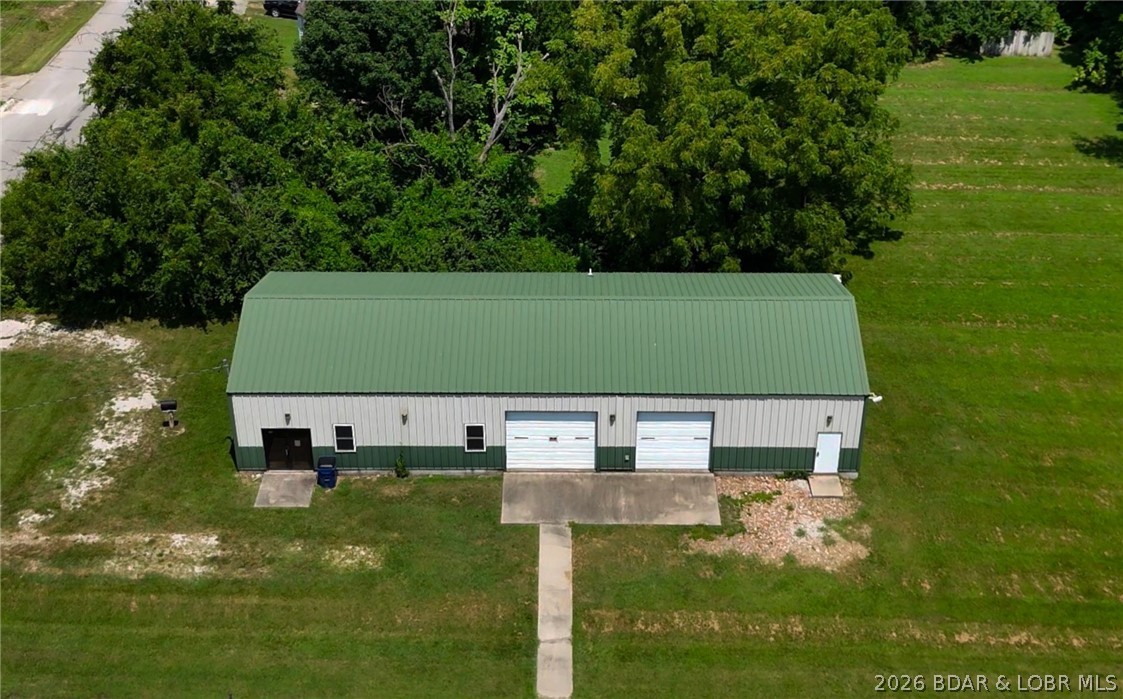 Build your new home at 801 E. 8th Street! This level lot is zoned R-2 and features a well-maintained, red-iron building offering more than 2,400 square feet of versatile space. Complete with a bathroom and a thoughtfully cared-for interior and exterior, the building provides excellent possibilities for storage, hobbies, a workshop, or other permitted uses. Located in a growing community known for strong employment opportunities and a highly regarded school district, this property offers small-town charm with modern convenience. Schedule your private showing today!