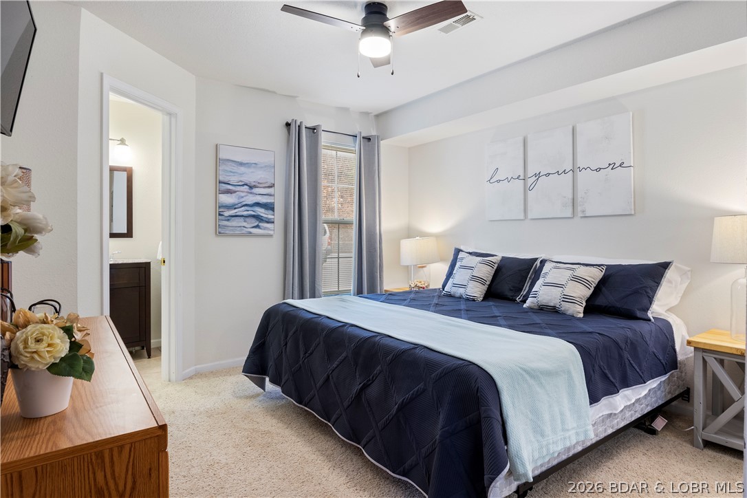 Sunrise Suite at Lighthouse Landing is a successful, income-producing vacation rental located at the 1 Mile Marker of Lake of the Ozarks. This waterfront 2-bedroom, 2-bath condo offers strong rental history and an unbeatable location just minutes from the Bagnell Dam Strip, Osage Beach, lakefront restaurants, and boat rentals.

The open-concept layout features a kitchen with stainless steel appliances, dining area for four, and a spacious living room with electric fireplace and lake views. Both bedrooms offer king-sized beds, including a lakeview primary suite with private bath. A second full bath provides added convenience for guests.

Enjoy the screened-in waterfront balcony with ample seating, perfect for relaxing after a day on the water. The complex includes a community pool and swim dock, and this unit comes with a 12x28 boat slip. Ideal as a personal lake retreat or turnkey investment property in a high-demand area.