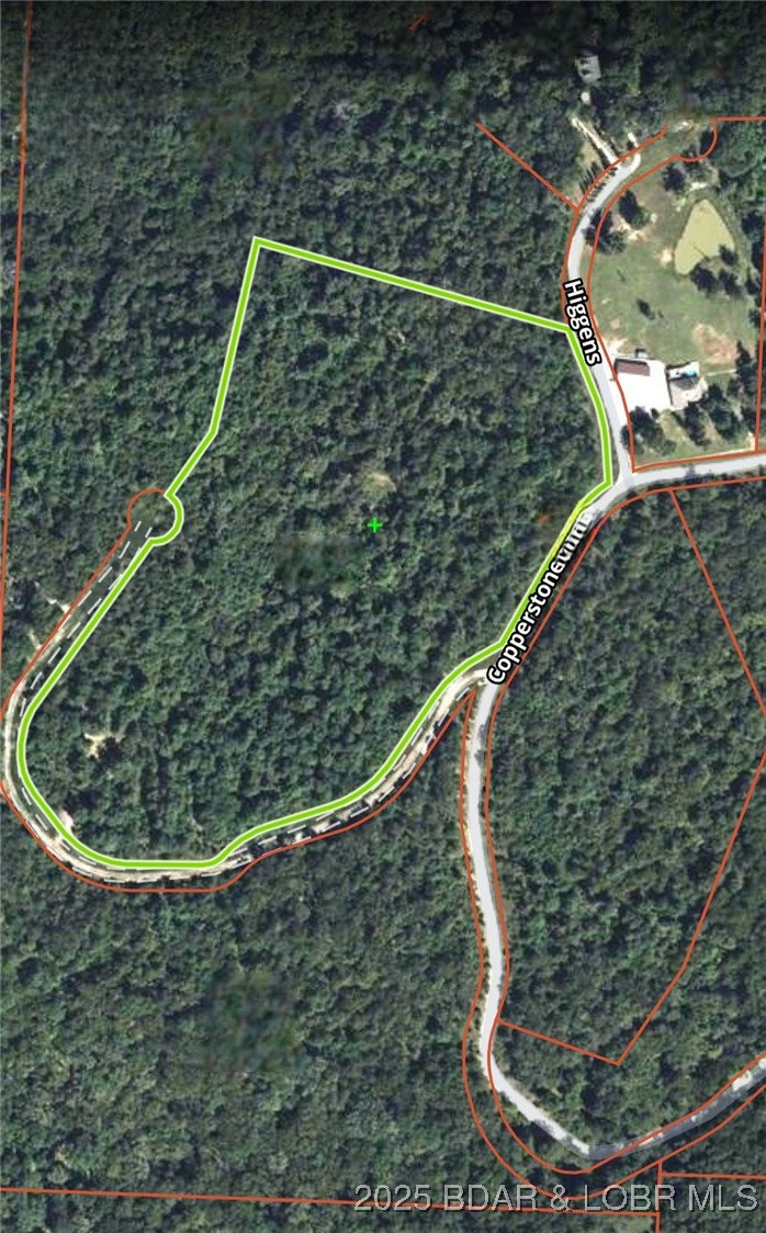 Discover more than 18 acres of beautiful wooded property at the Lake of the Ozarks, already divided into four separate lots, creating exceptional flexibility for a private estate, family compound, investment opportunity, or future resale. Multiple cleared, level building sites are ready for your dream home, weekend getaway, or custom development. Outdoor enthusiasts will appreciate the abundant wildlife, including whitetail deer and turkey, with established food plots making this property a true hunter's retreat. The mature timber provides privacy, natural beauty, and potential timber value. Conveniently located just minutes from Highway 5, Highway 7, the Hurricane Deck Bridge, a public boat ramp, and several popular lakefront restaurants, you'll enjoy quick access to boating, fishing, golf, shopping, and all the recreation the Lake of the Ozarks has to offer. Located in Copperstone Estates near Camdenton in an area of quality homes, this unique property offers the perfect combination of peaceful country living, investment potential, and convenient access to the lake lifestyle.
