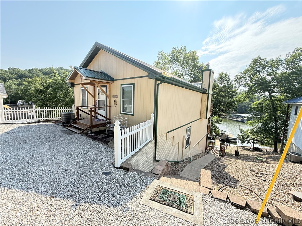 Don't miss this incredible 3-story, 4-bedroom, 2-bath lakefront home sitting in a peaceful cove on the 6 MM of the Gravois Arm! Whether you're looking for a full-time residence, vacation getaway, or income-producing investment, this property has it all.
Enjoy breathtaking lake views from three levels of spacious decks, or relax on the martini deck by your private one-well dock while taking in the sunset. The walk-out basement offers additional living space and room to add a fifth bedroom, increasing both flexibility and rental potential.With ample parking and short-term rentals allowed, this home is ready to welcome family, friends, or vacation guests. Located just minutes from 2 UTV parks and easy access to waterfront restaurants, shopping, entertainment, and miles of off-road trails. Spend the morning on the water, then switch gears and enjoy an afternoon of ATV or UTV riding. Recent updates to the home include 2 new Quaker windows facing the parking area and new carpet in the entry and both bedrooms on main level.
You'll also appreciate the convenience of community water and sewer, eliminating the maintenance of a well and septic system.
Schedule your private showing today!